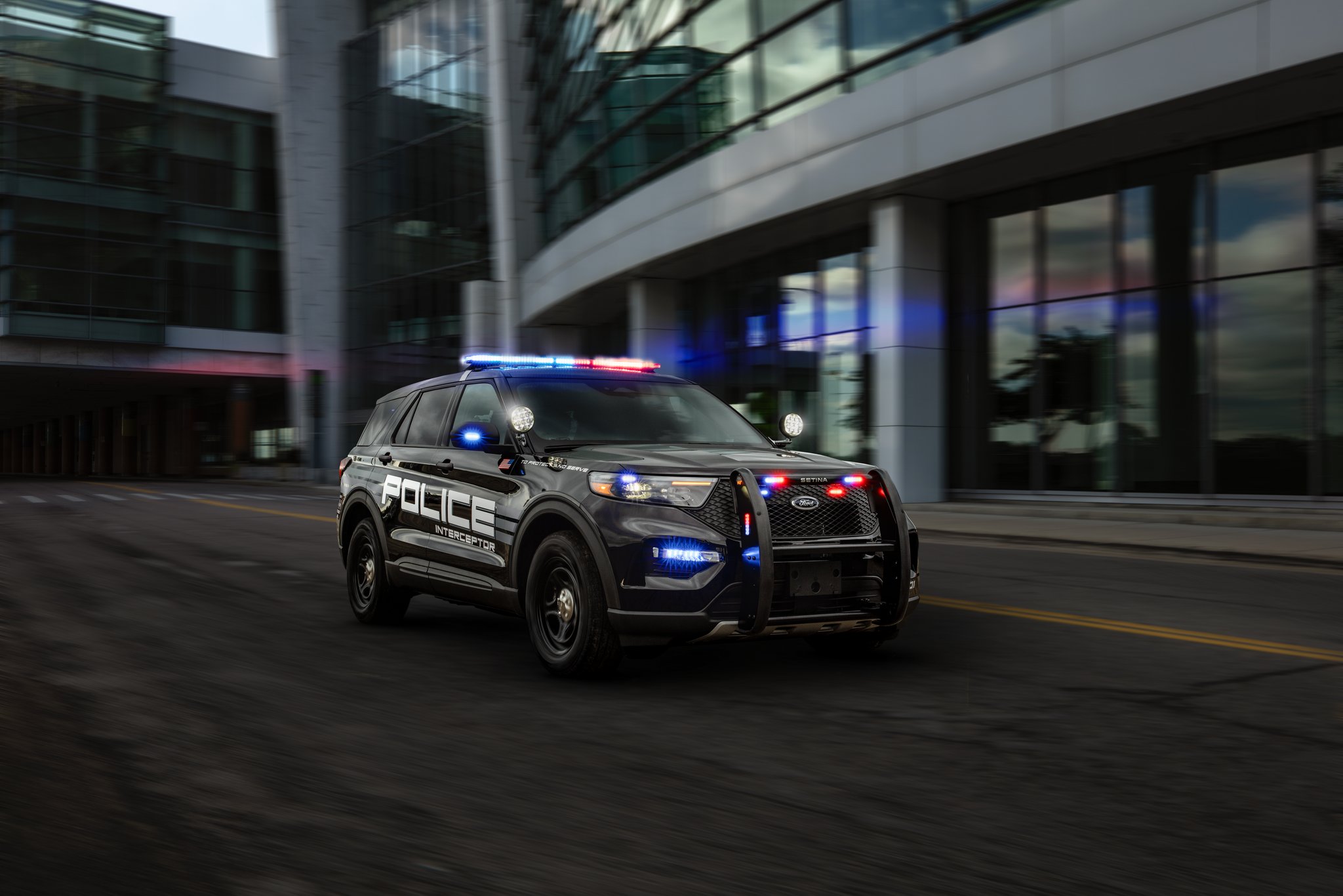 A 2025 Ford Police Interceptor® Utility being driven in an urban environment