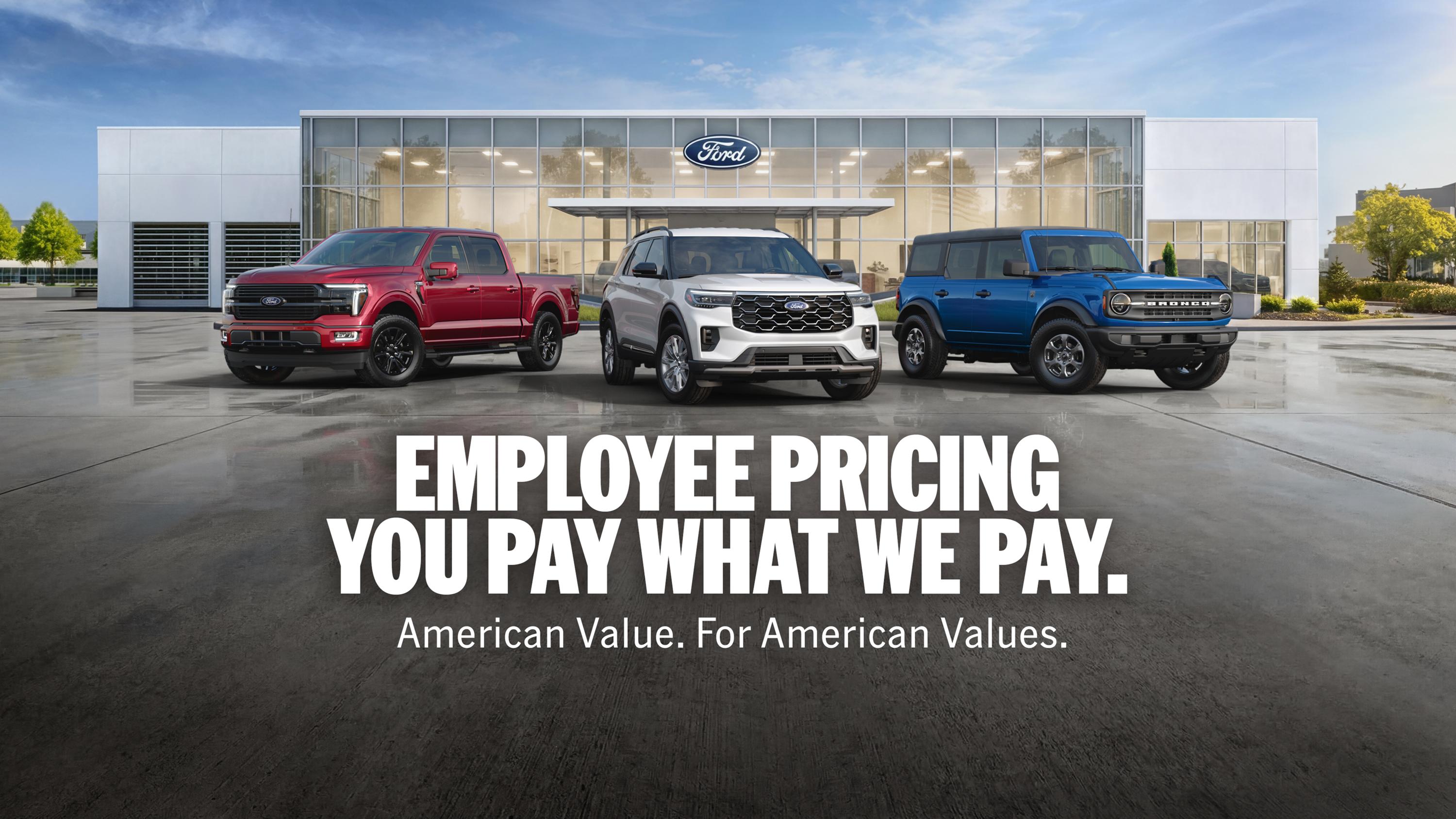  An exterior shot of a Ford dealership with a lineup of 2026 Ford vehicles out front  