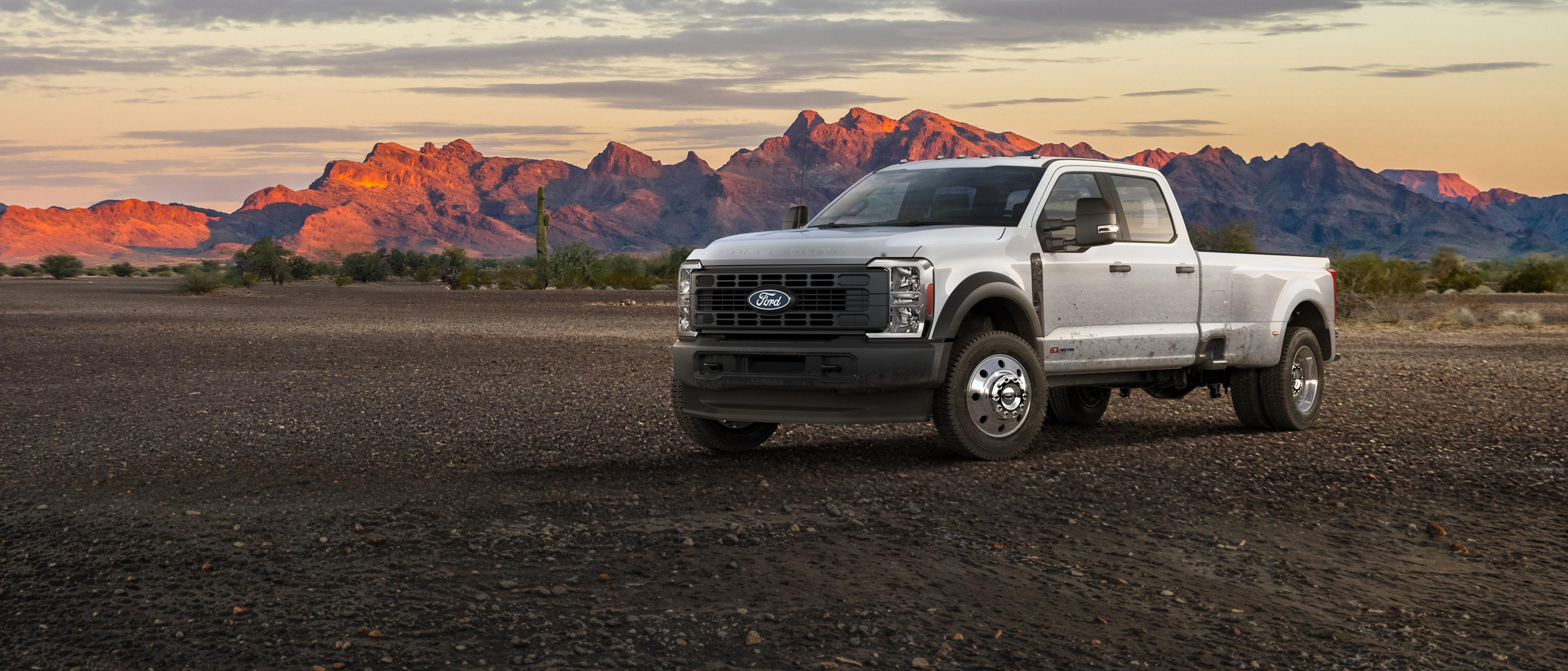 2027 Ford Super Duty® F-450® XL truck parked on a dirt road in the mountains