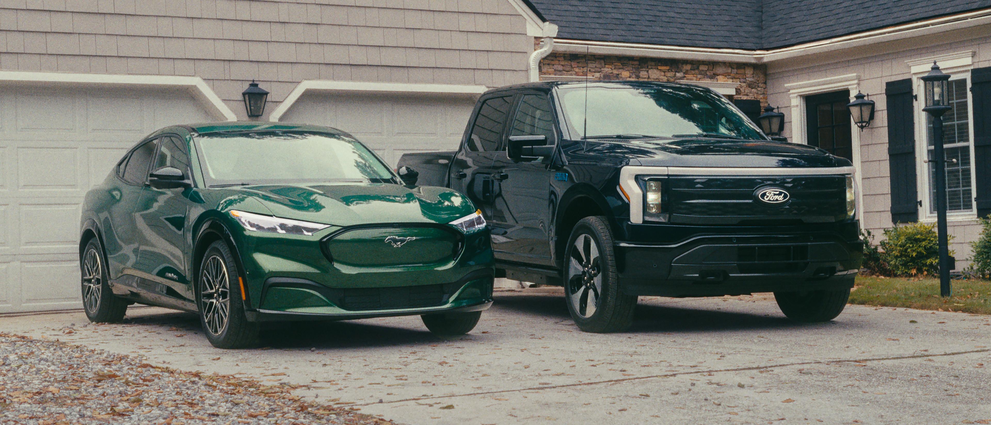 A 2024 Ford Mustang Mach-E and a 2024 Ford F-150 Lightning parked in a driveway