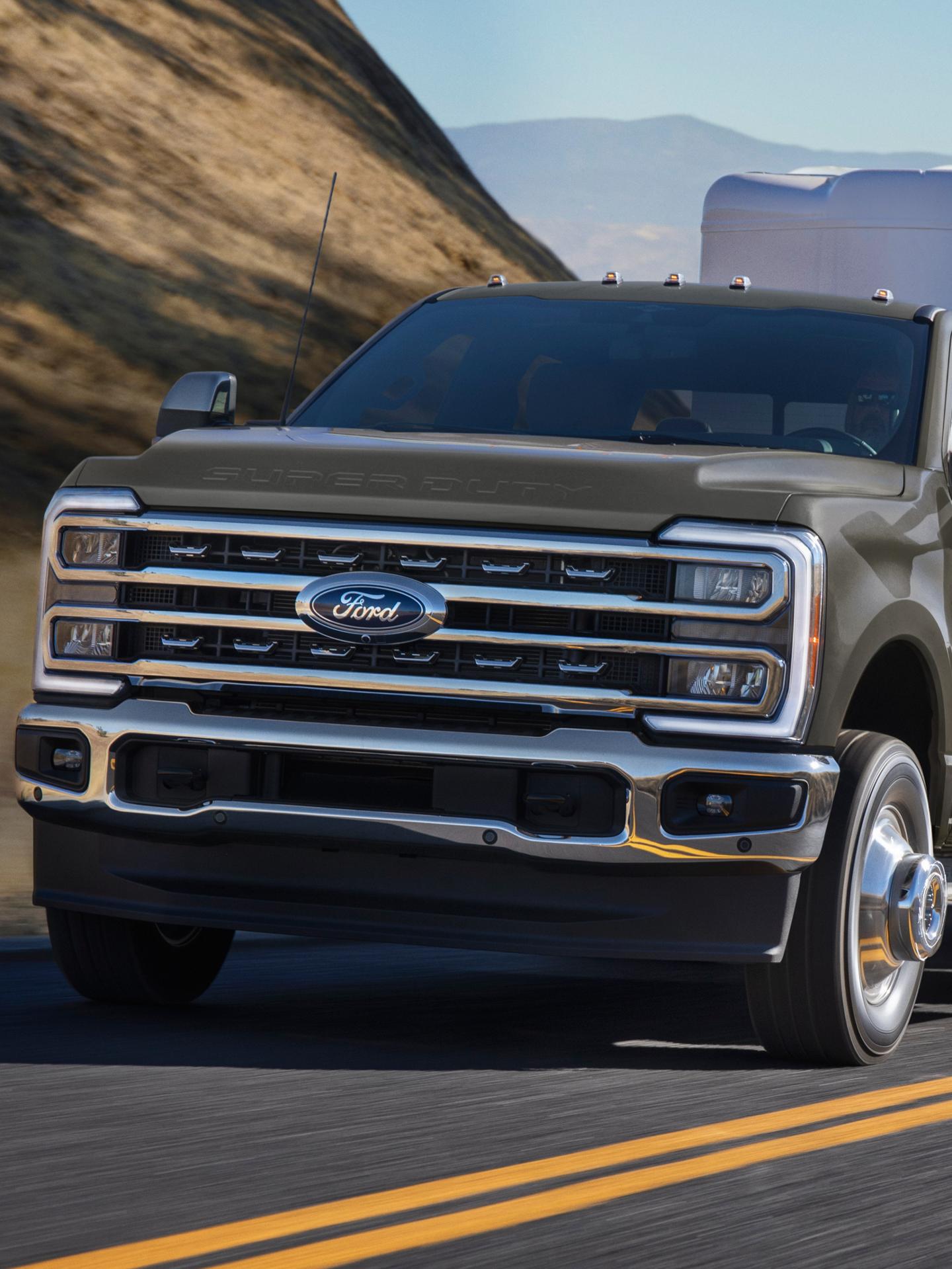 2026 Ford Super Duty® F-350® Lariat® model in Marsh Gray parked on a rocky mountain road