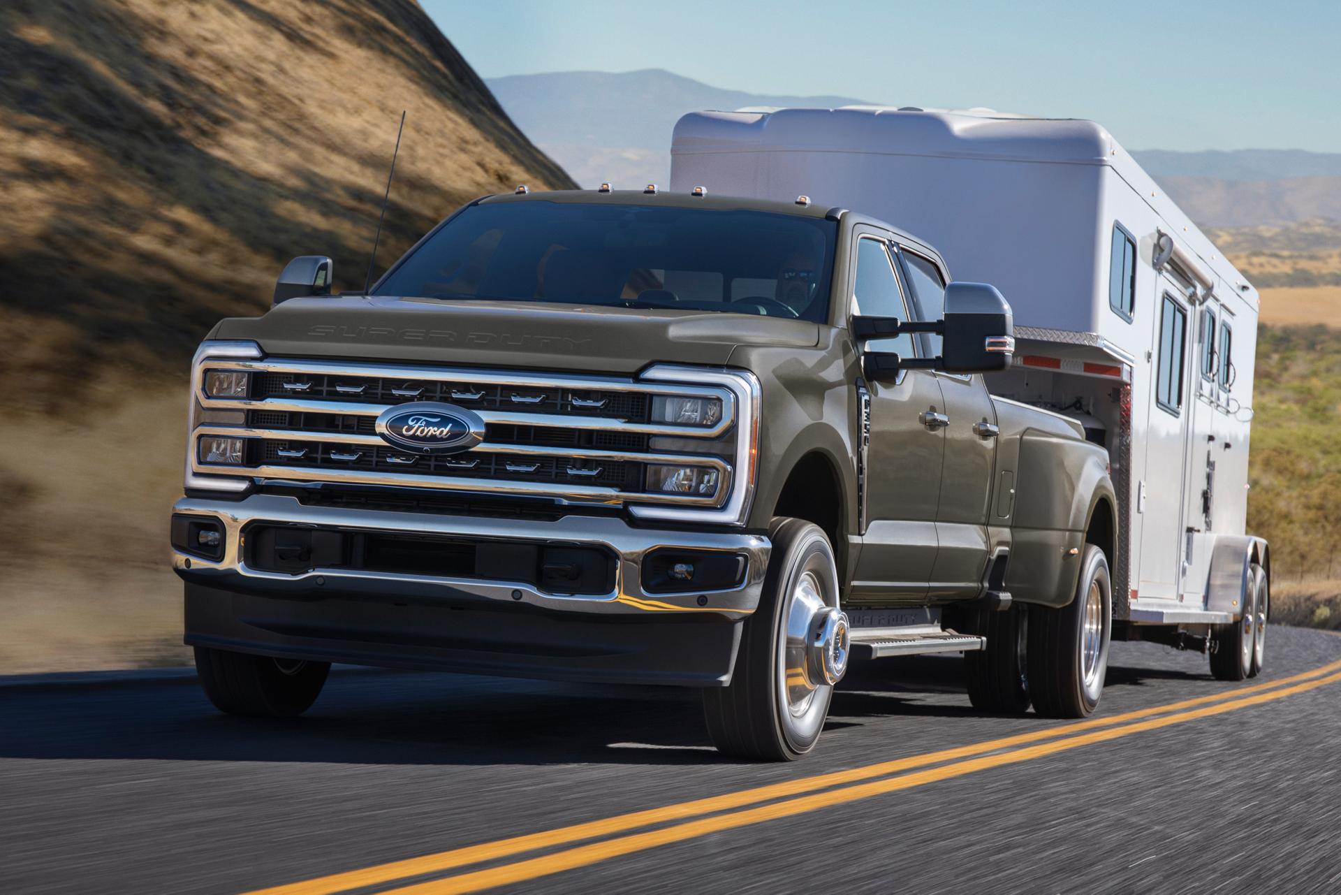 2026 Ford Super Duty® F-350® Lariat® model in Marsh Gray parked on a rocky mountain road