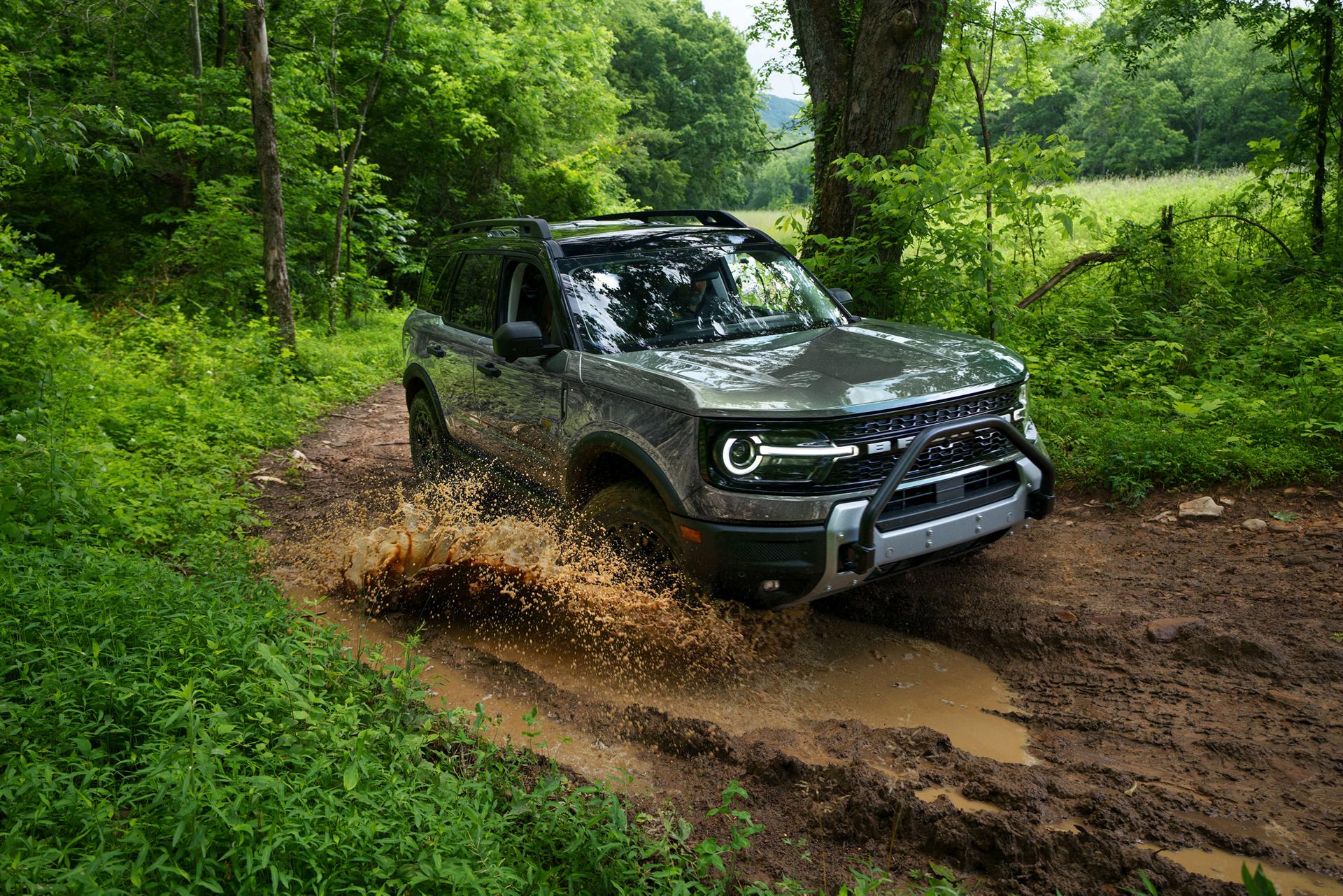 2026 Ford Bronco Sport® being driven on a dirt trail in the woods