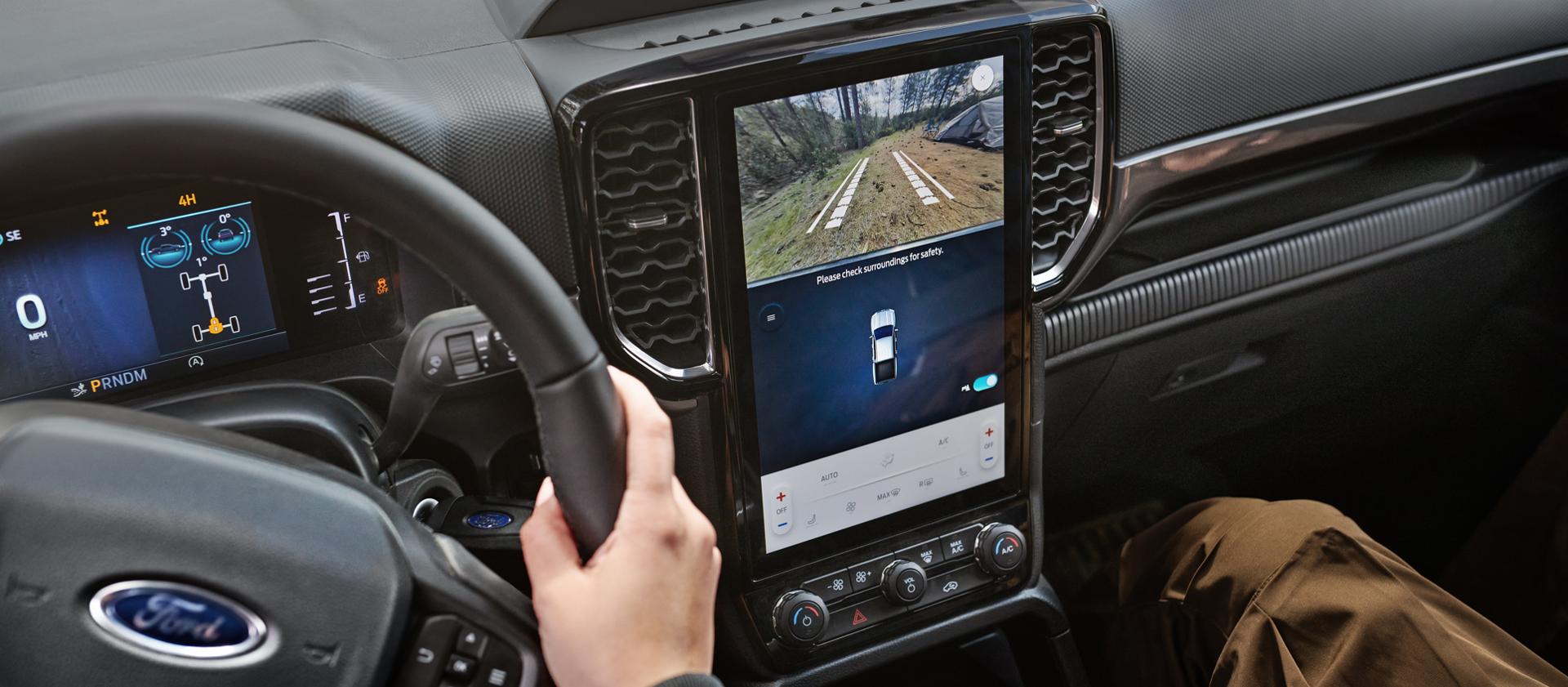 Interior view of the 2026 Ford Ranger® XLT model highlighting the center display, cluster display, and steering wheel