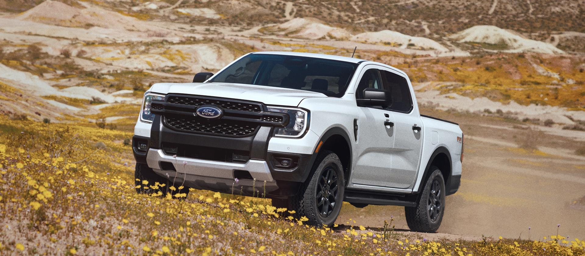 2026 Ford Ranger® XLT truck being driven on an uneven, grassy terrain