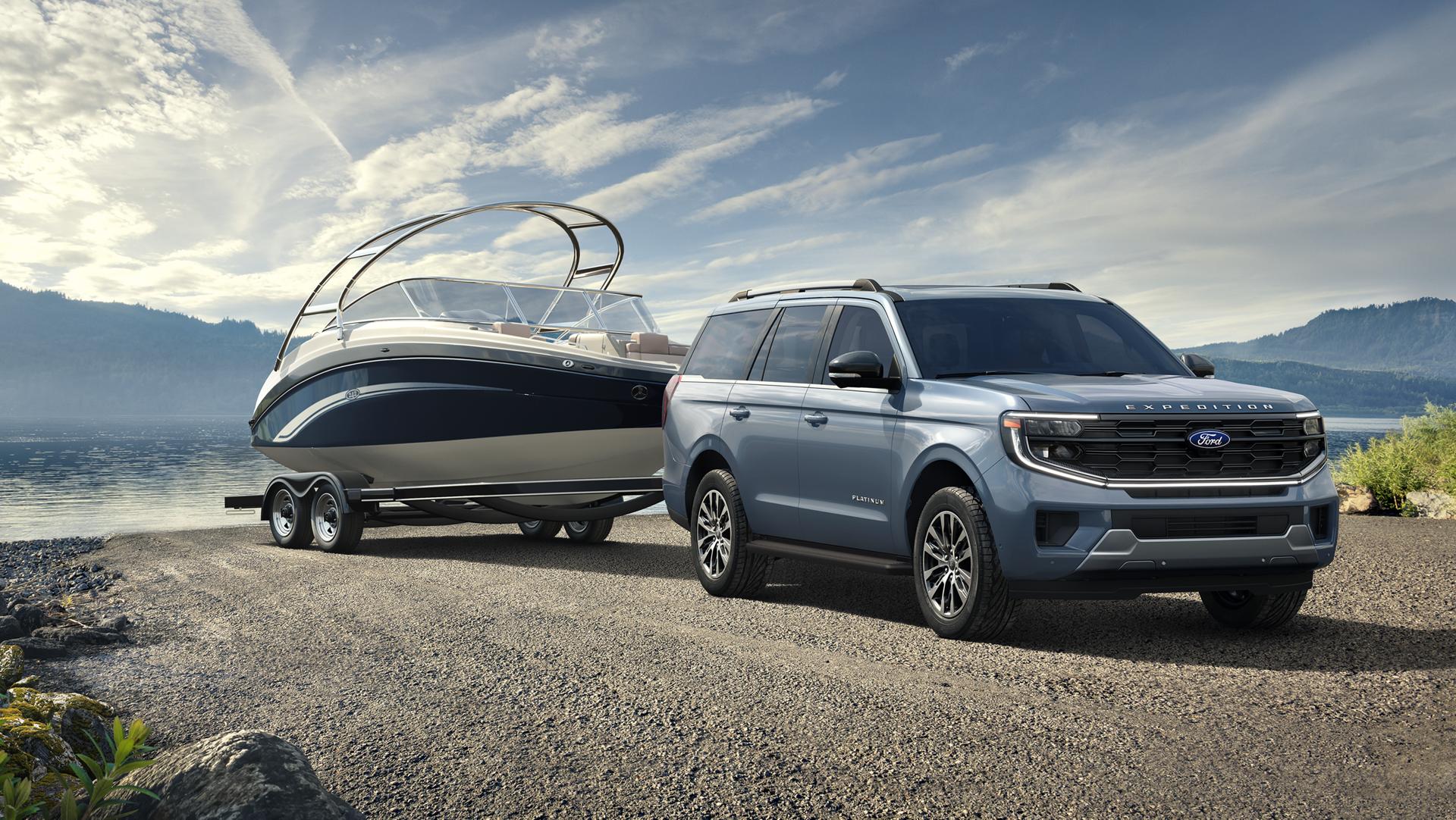 2026 Ford Expedition® model with a driver towing a boat on a trailer
