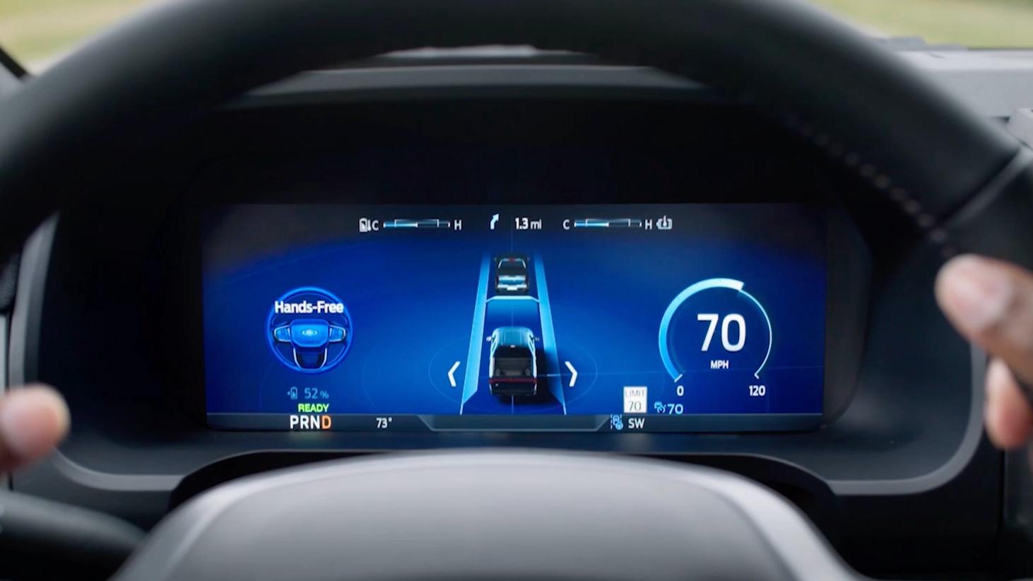 A driver at the wheel of a 2025 Ford F-150® Lightning® pickup