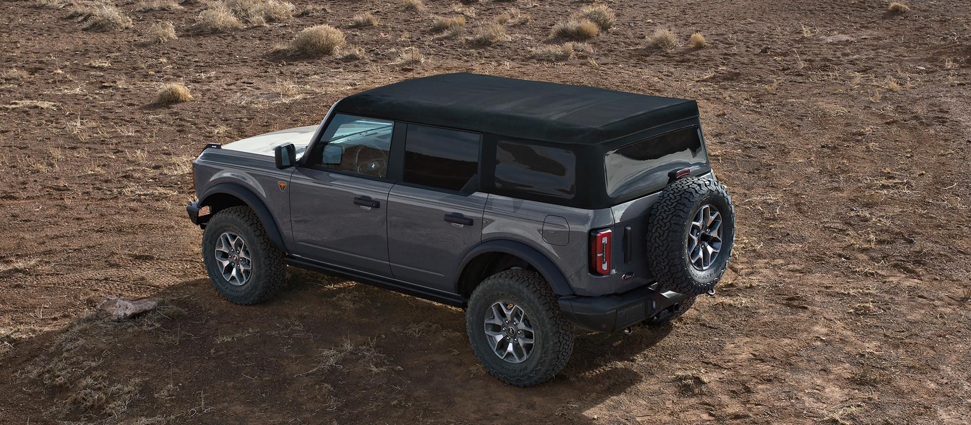 A 2026 Ford Bronco® SUV with the soft top folded back/the hard top removed