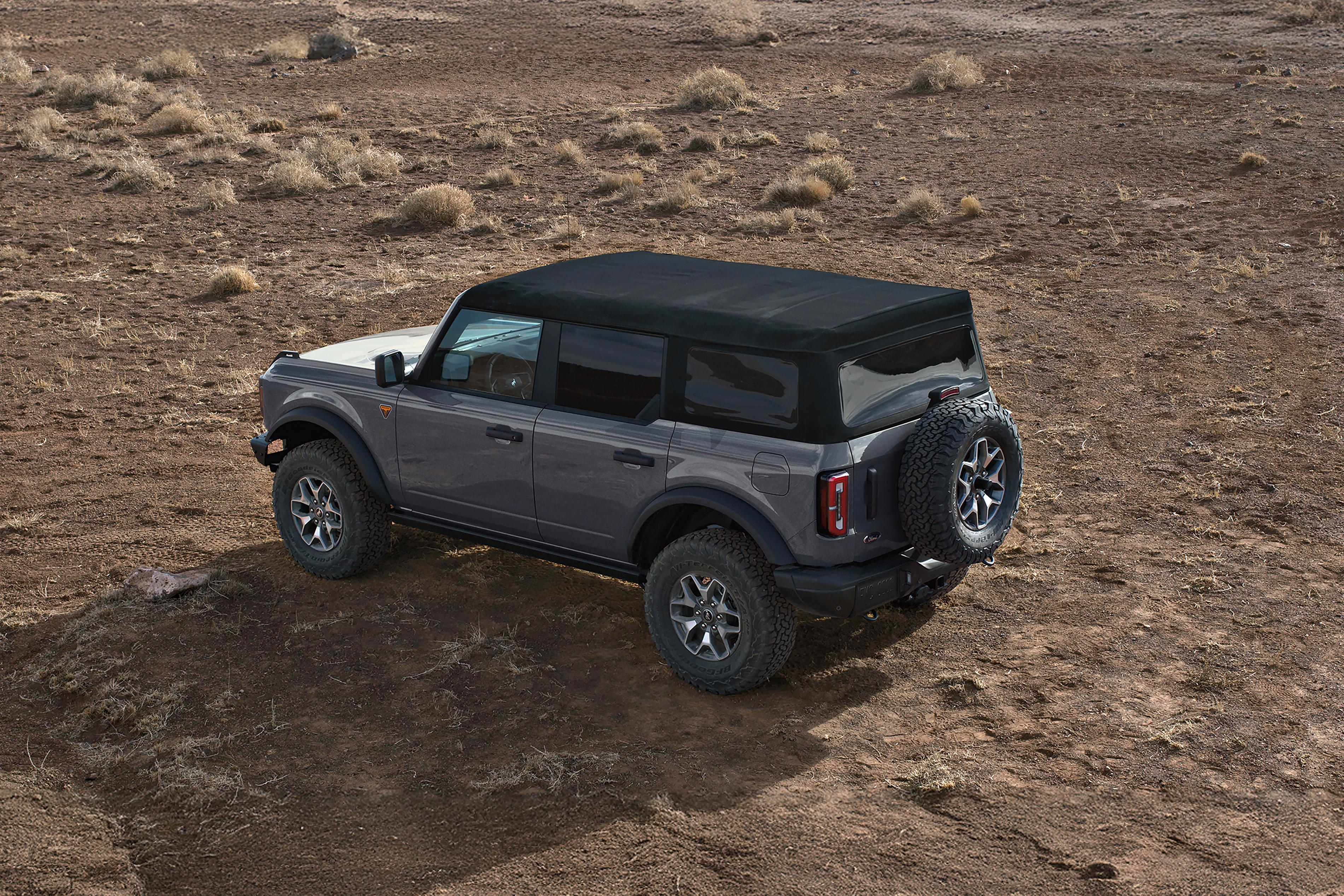 A 2026 Ford Bronco® SUV with the soft top folded back/the hard top removed