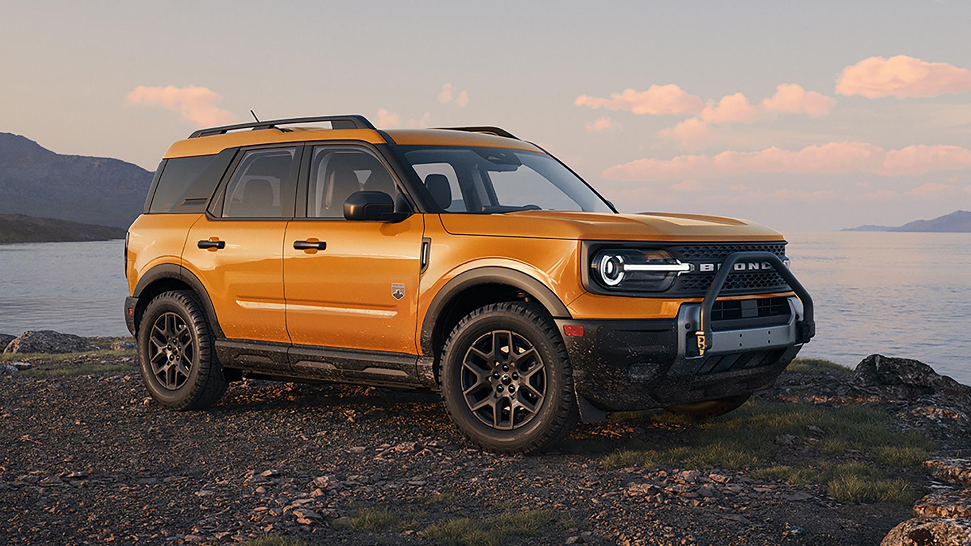 A 2026 Ford Bronco Sport® SUV parked on gravel next to a lake