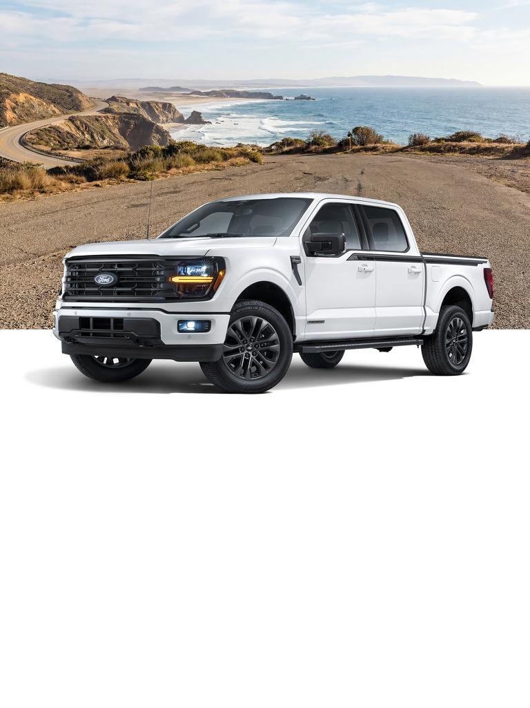 White Ford F-150® truck with the California Package, with a coastal ocean shoreline background