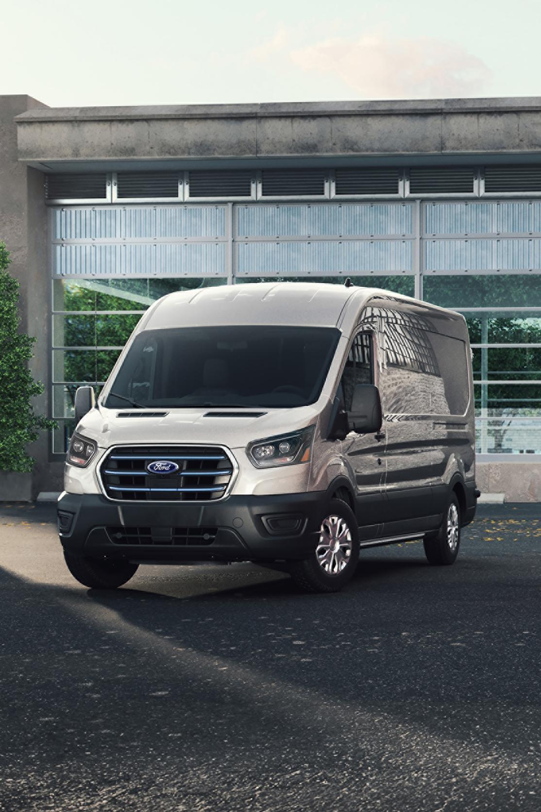 Ford E-Transit™ models parked in front of an office building