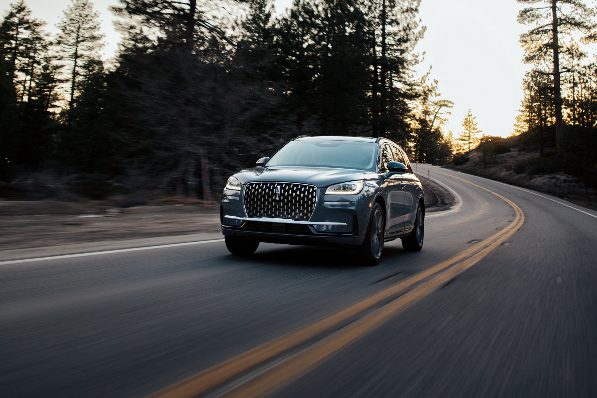 The jewel-like headlamps of a 2026 Lincoln Corsair® SUV emit a concise array of light