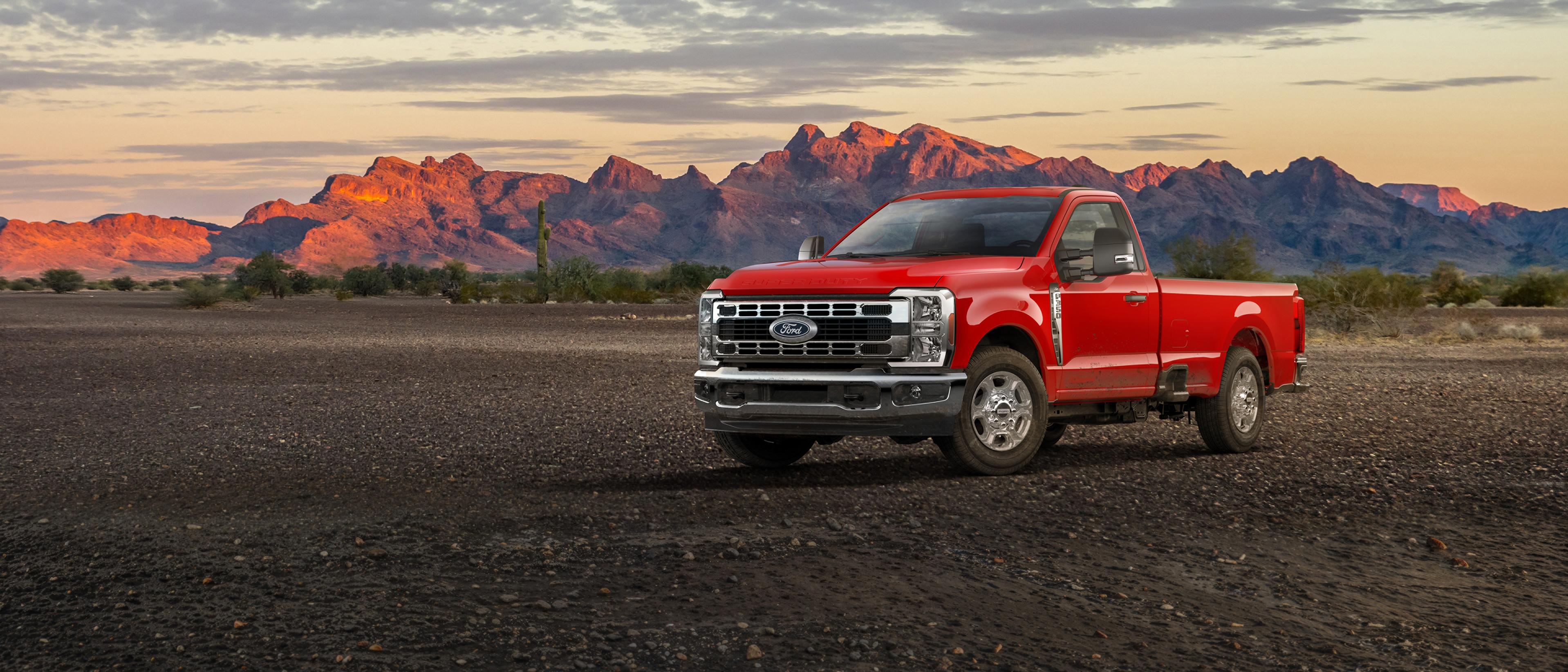 2027 Ford Super Duty® F-350® XLT truck parked on a dirt road in the mountains