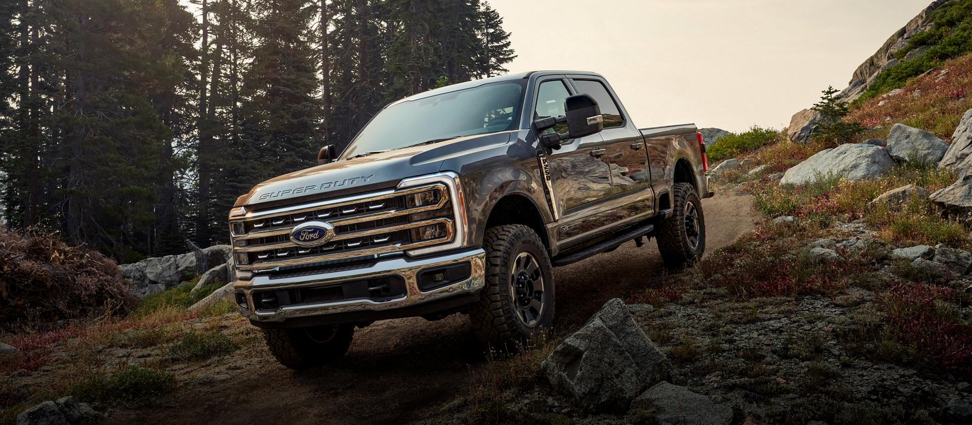 2026 Ford Super Duty® F-250® pickup with the available Tremor® Off-Road Package parked on a rocky mountain side