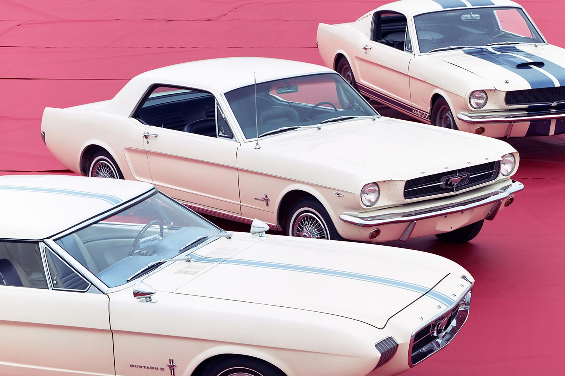 Three Mustang cars lined up