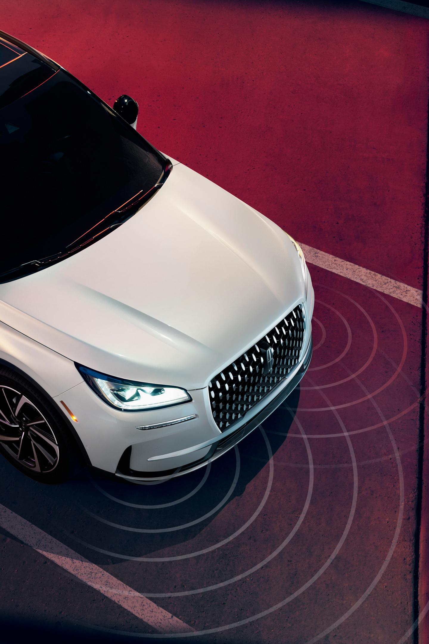 Simulated sensing waves emit from a 2025 Lincoln Corsair Reserve to demonstrate Pre-Collision Assist