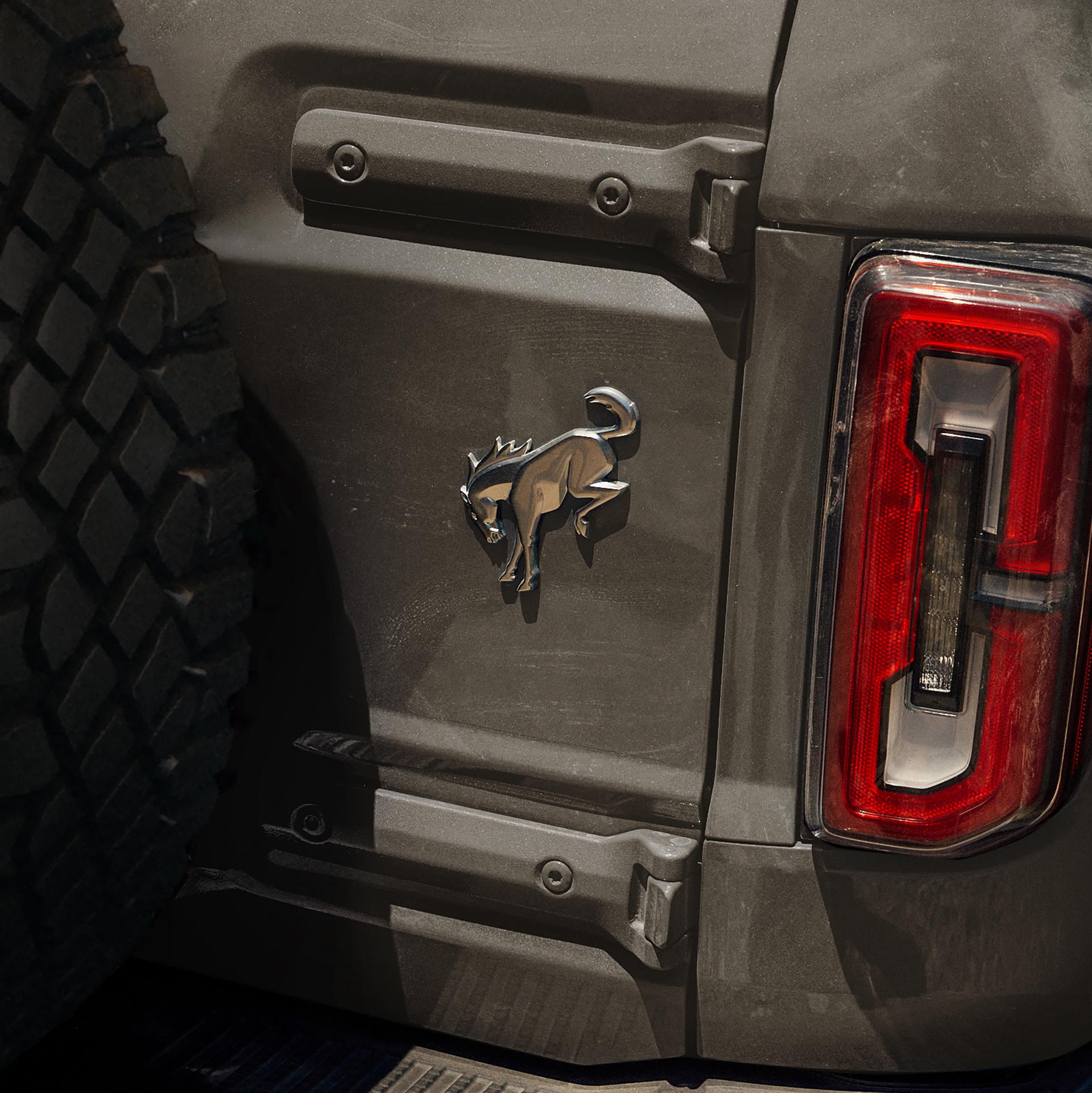 A close-up of the Bronco badge on the rear swing gate of a 2026 Ford Bronco® Stroppe Edition SUV