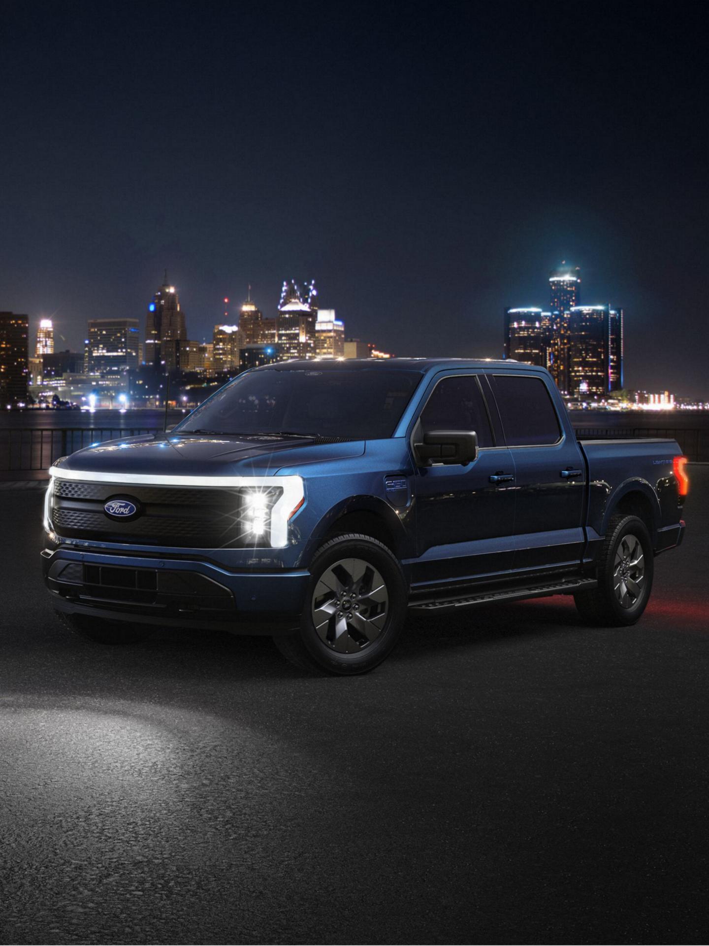 2025 Ford F-150 Lightning truck parked pavement on the other side of the Detroit river