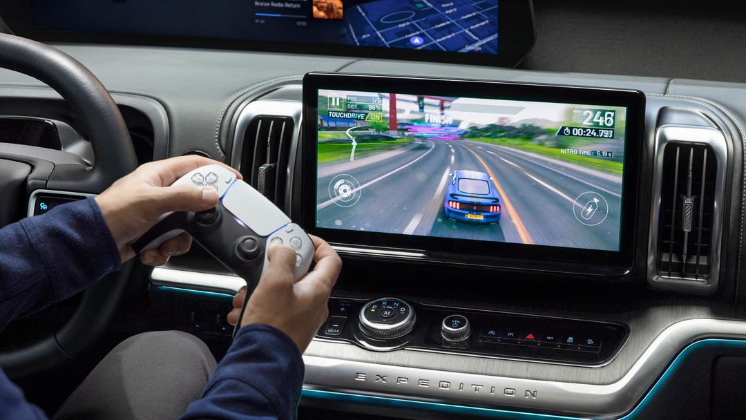 Parked 2026 Ford Expedition® SUV 13.2-inch center display with driver playing a video game