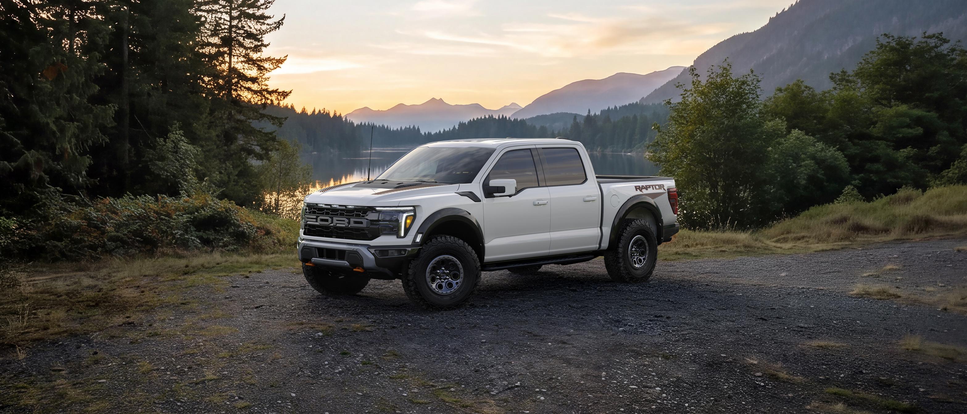 2027 Ford F-150® Raptor® model parked near a mountain lake