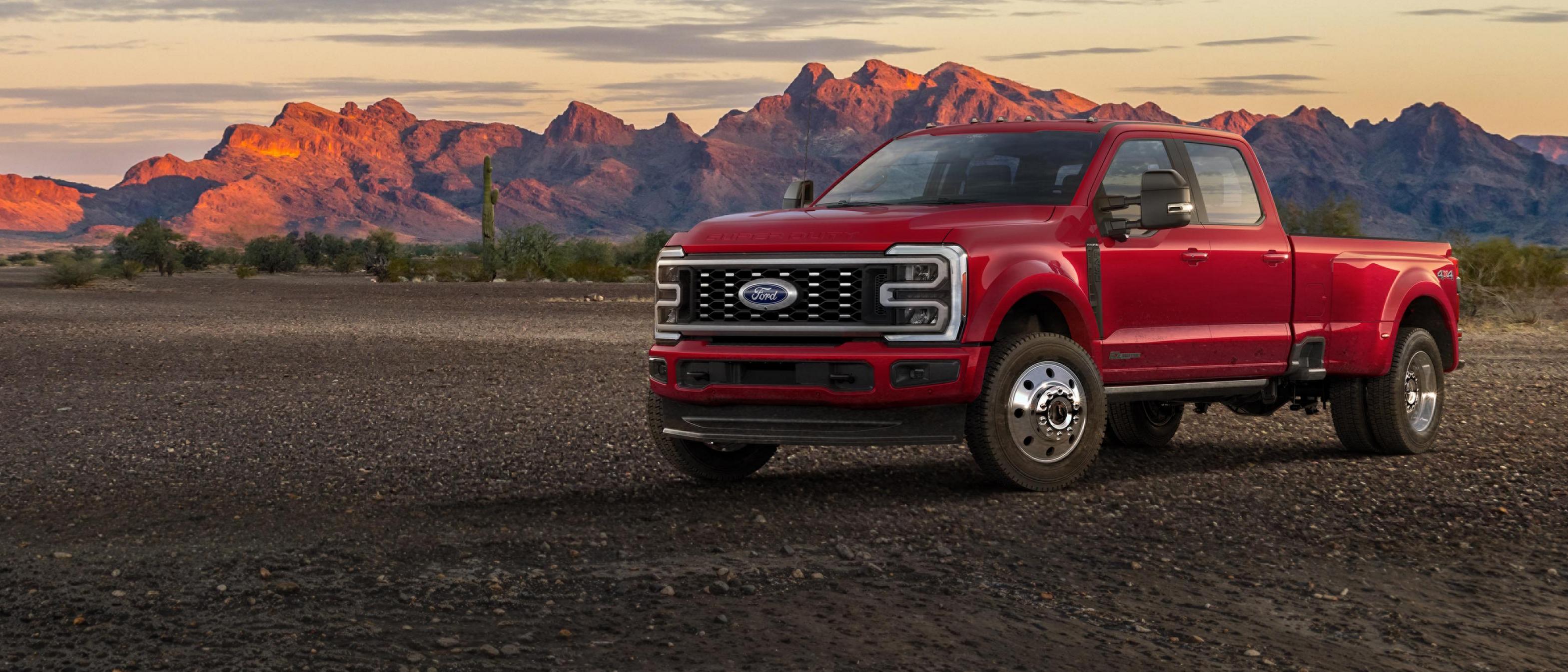 2026 Ford Super Duty F-450 Platinum truck parked on a dirt road in the mountains