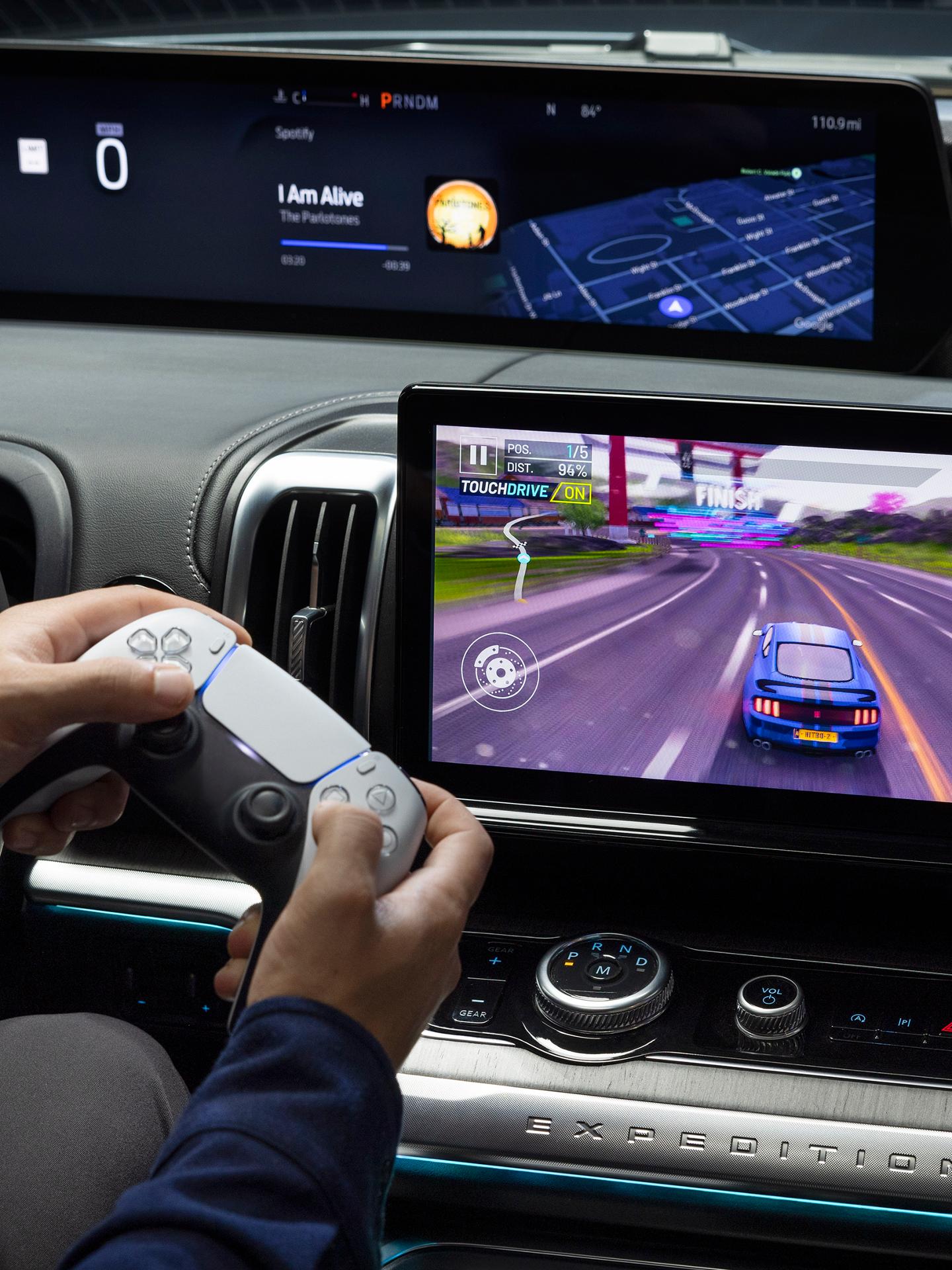 Parked 2026 Ford Expedition® SUV 13.2-inch center display with driver playing a video game