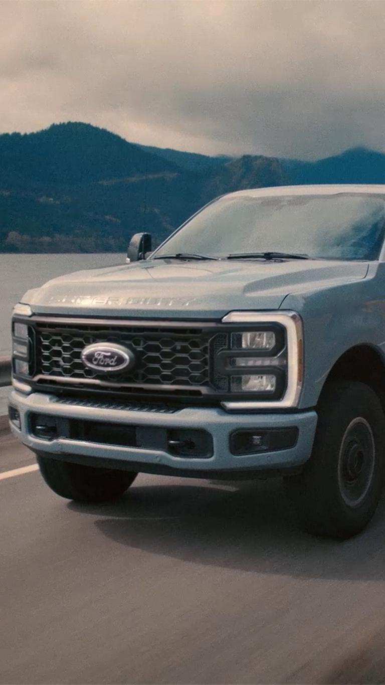 2026 Ford Super Duty® driving by a lake