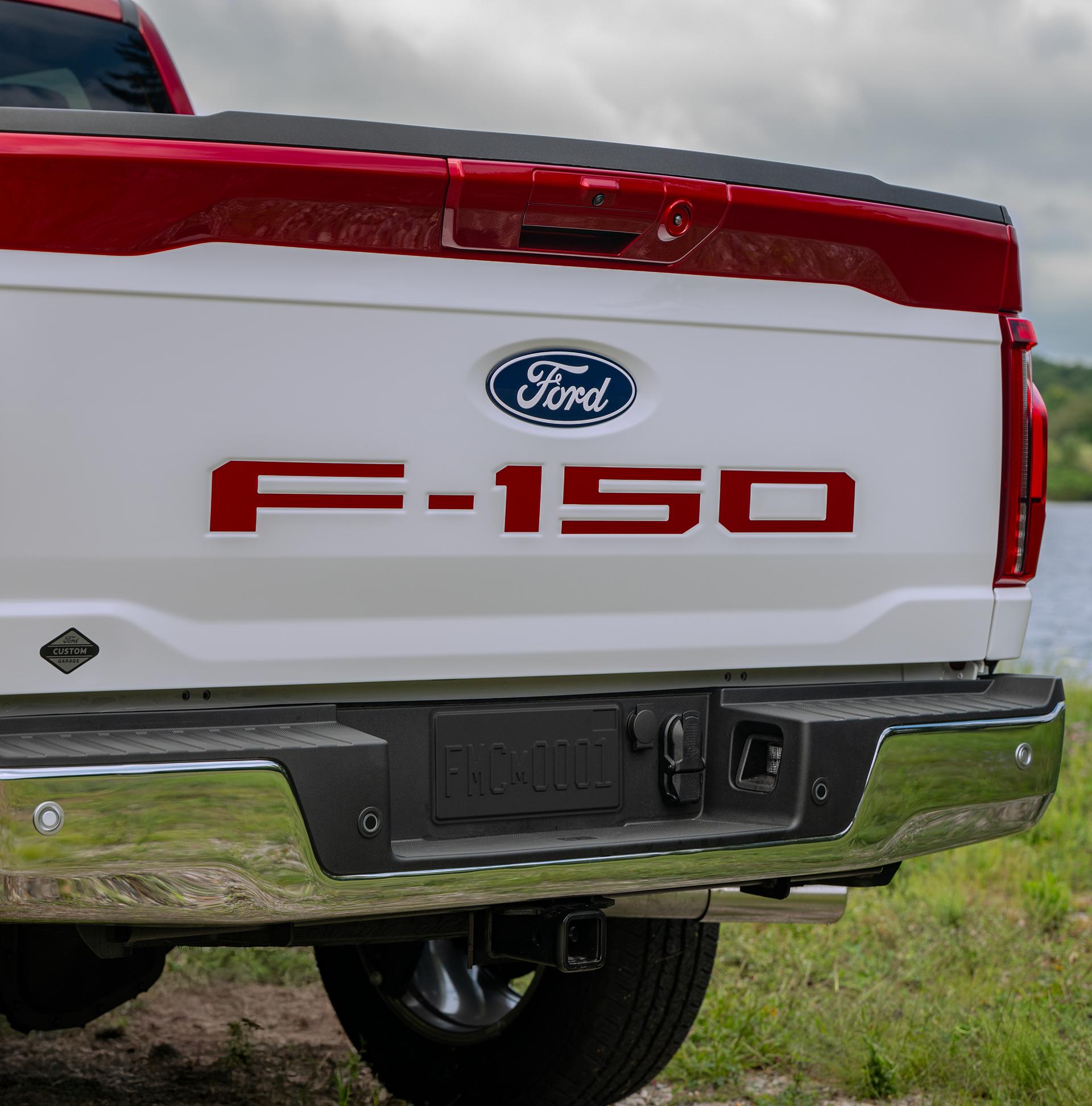 2027 Ford F-150® truck Two-Tone Package tailgate with red lettering, white tailgate panel, and dark red exterior accents