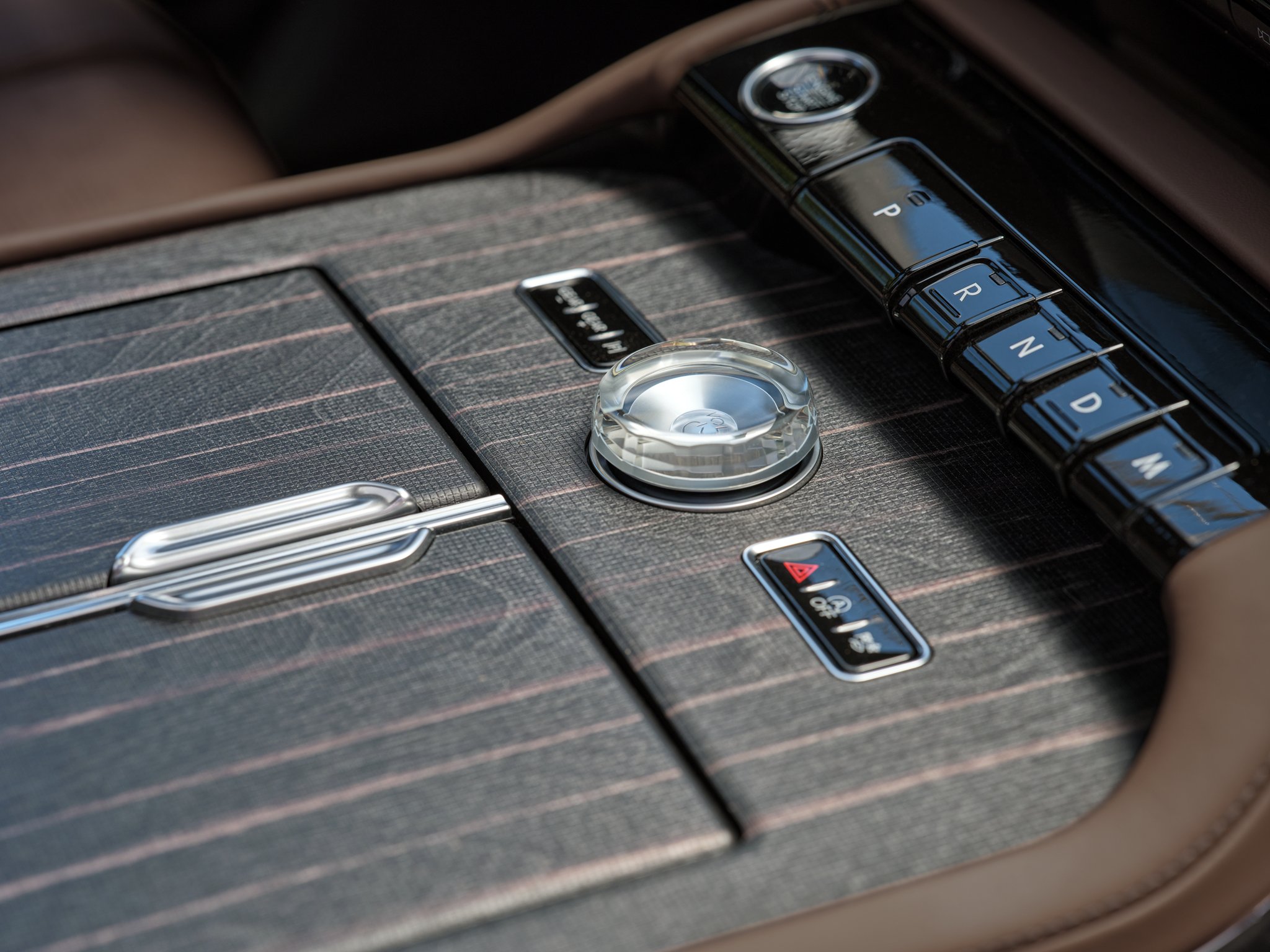 Real wood appliqués of the center console of 2025 Lincoln Black Label Navigator® SUV
