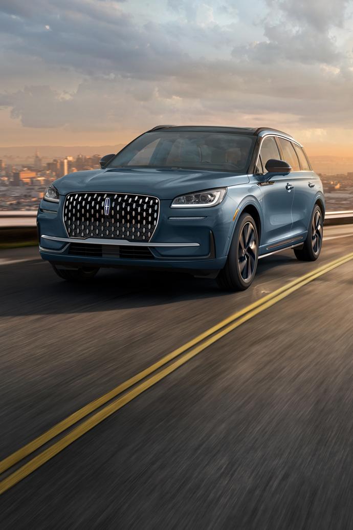 A 2025 Lincoln Corsair® Grand Touring plug-in hybrid SUV is being driven using the Lane-Keeping System