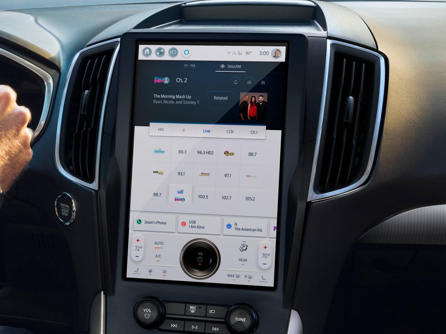 The SYNC touchscreen in the center stack of a 2021 Ford Edge. The screen is displaying the SiriusXM satellite radio interface.