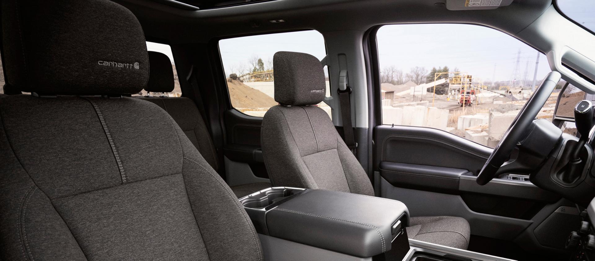 Front seats view inside the 2027 Ford Super Duty® F-350® XLT with the Super Duty Carhartt® Package