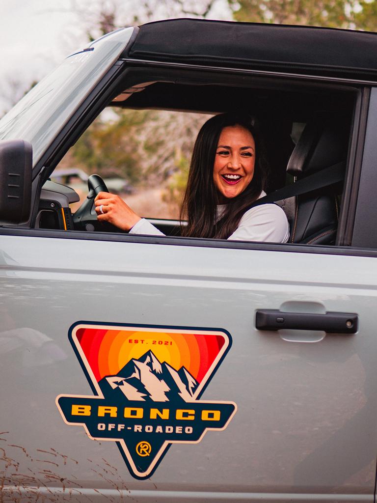Ford Bronco® SUV with a new owner learning behind the wheel at a Bronco Off-Roadeo® event