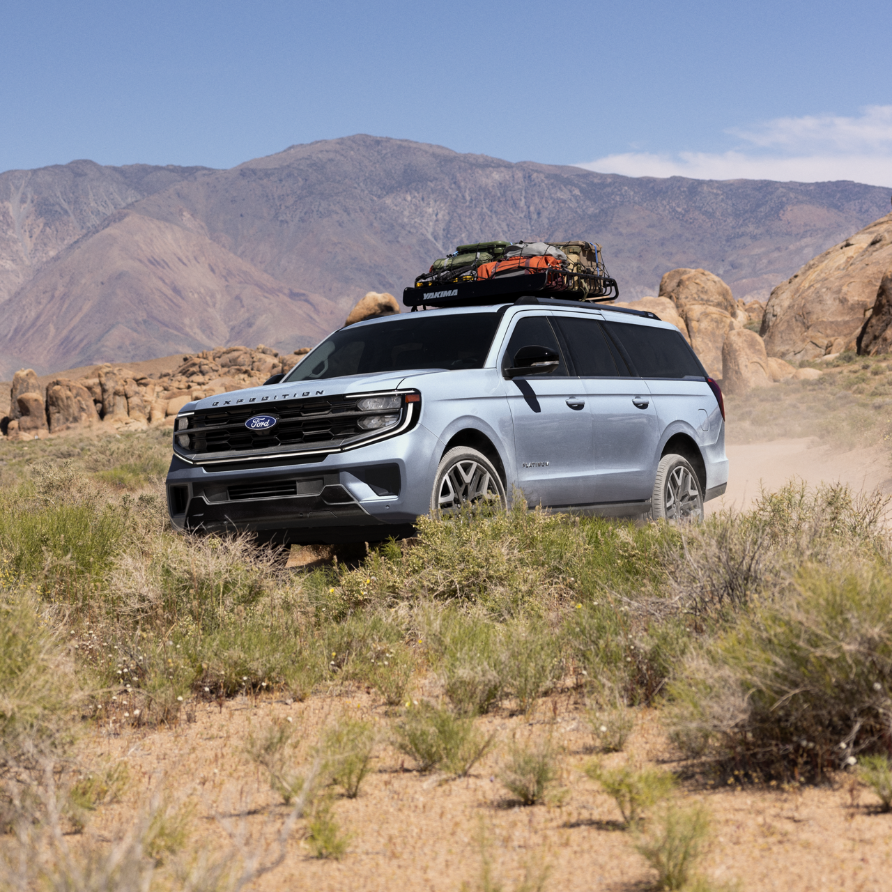 2027 Ford Expedition® Platinum® model with optional equipment and available Ford accessories shown being driven in a desert