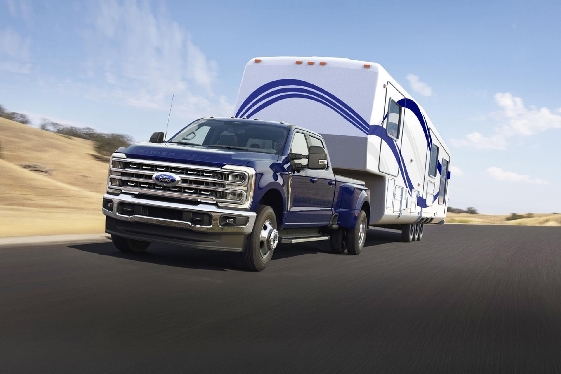 Blue 2026 Ford Super Duty® truck towing a trailer
