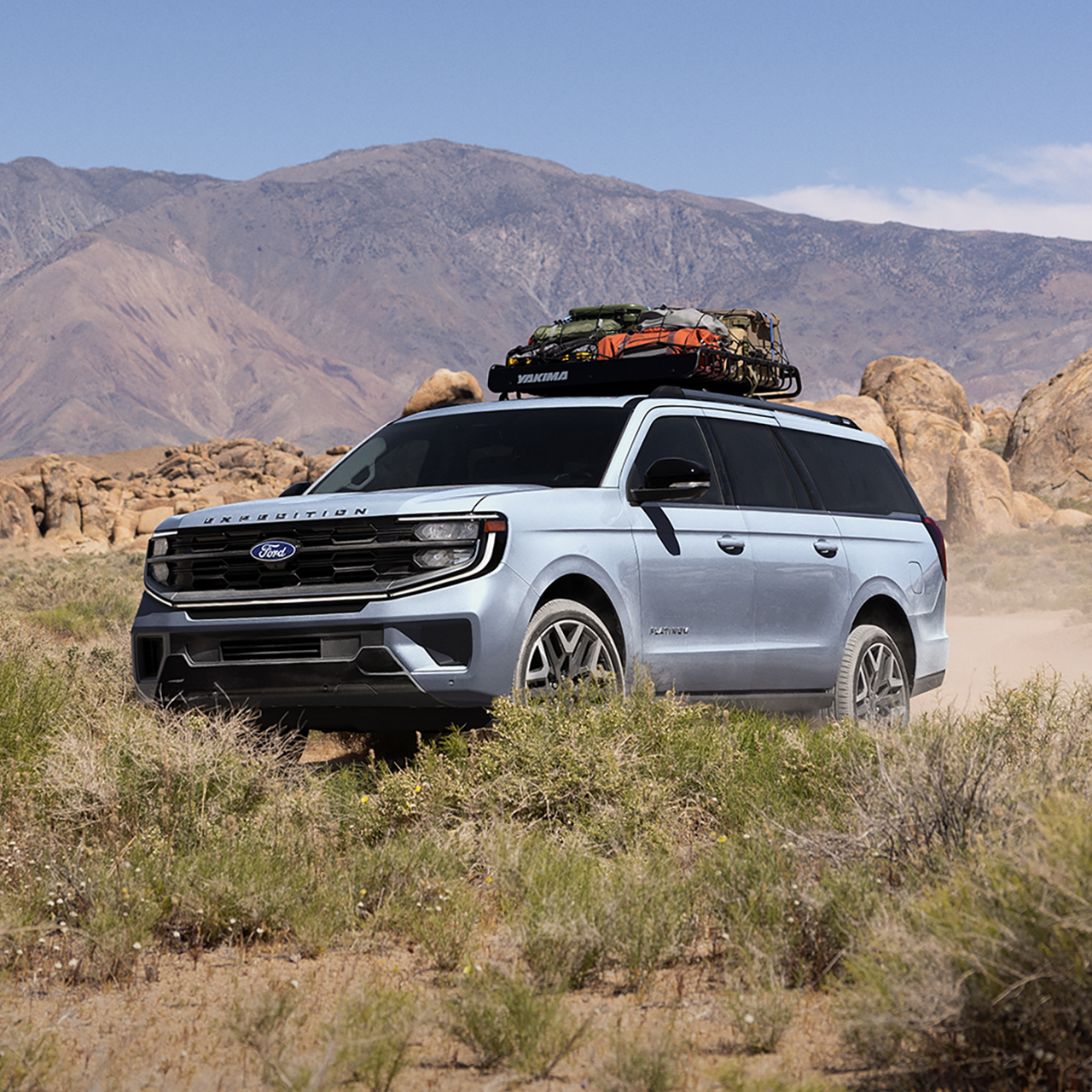 2027 Ford Expedition® Platinum® model with optional equipment and available Ford accessories shown being driven in a desert