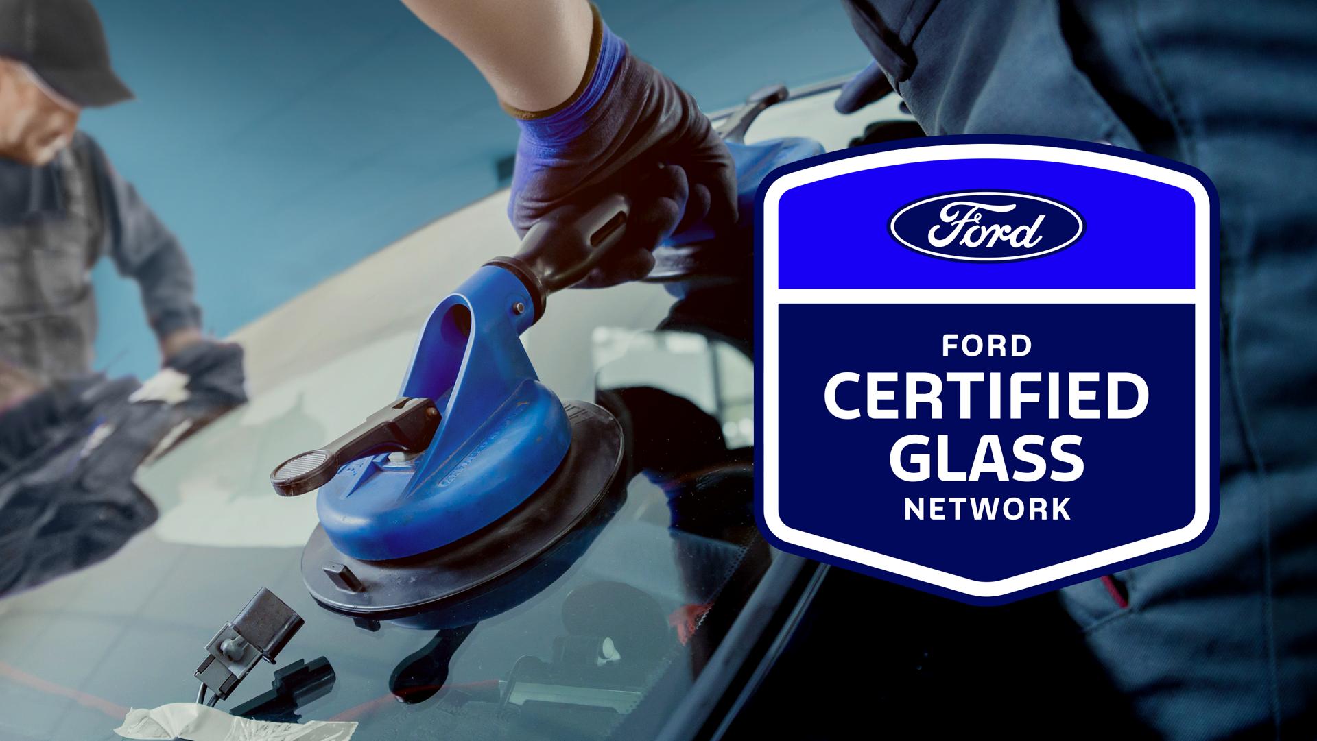 Ford Certified Glass Center logo over Ford technicians installing a windshield