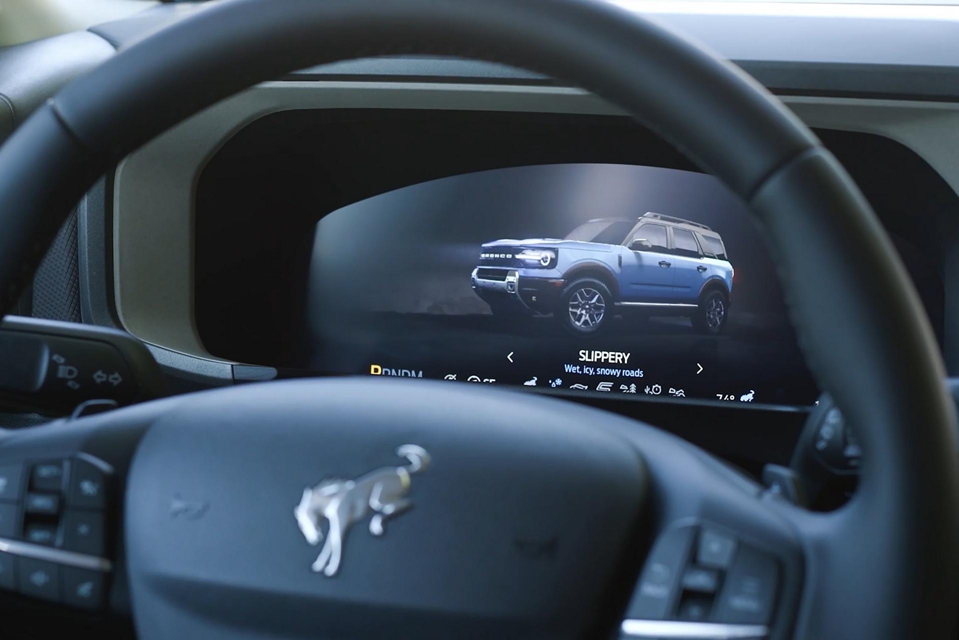 Interior of vehicle showing steering wheel and vehicle dashboard
