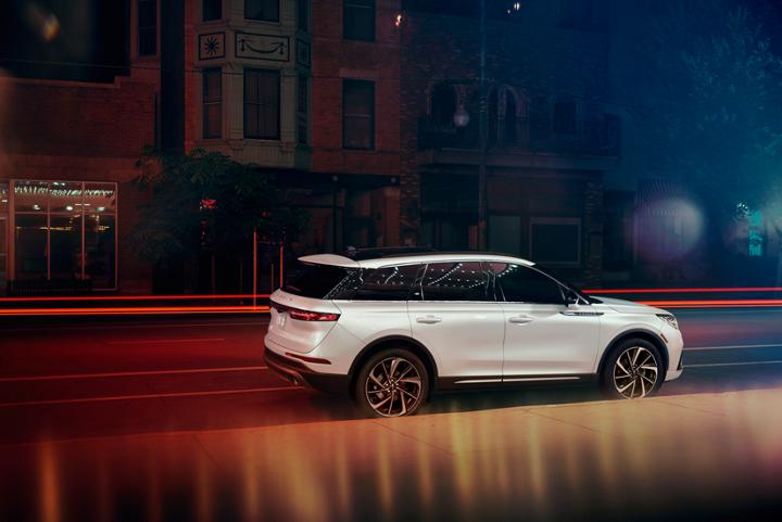 A 2025 Lincoln Corsair is parked in the city at night