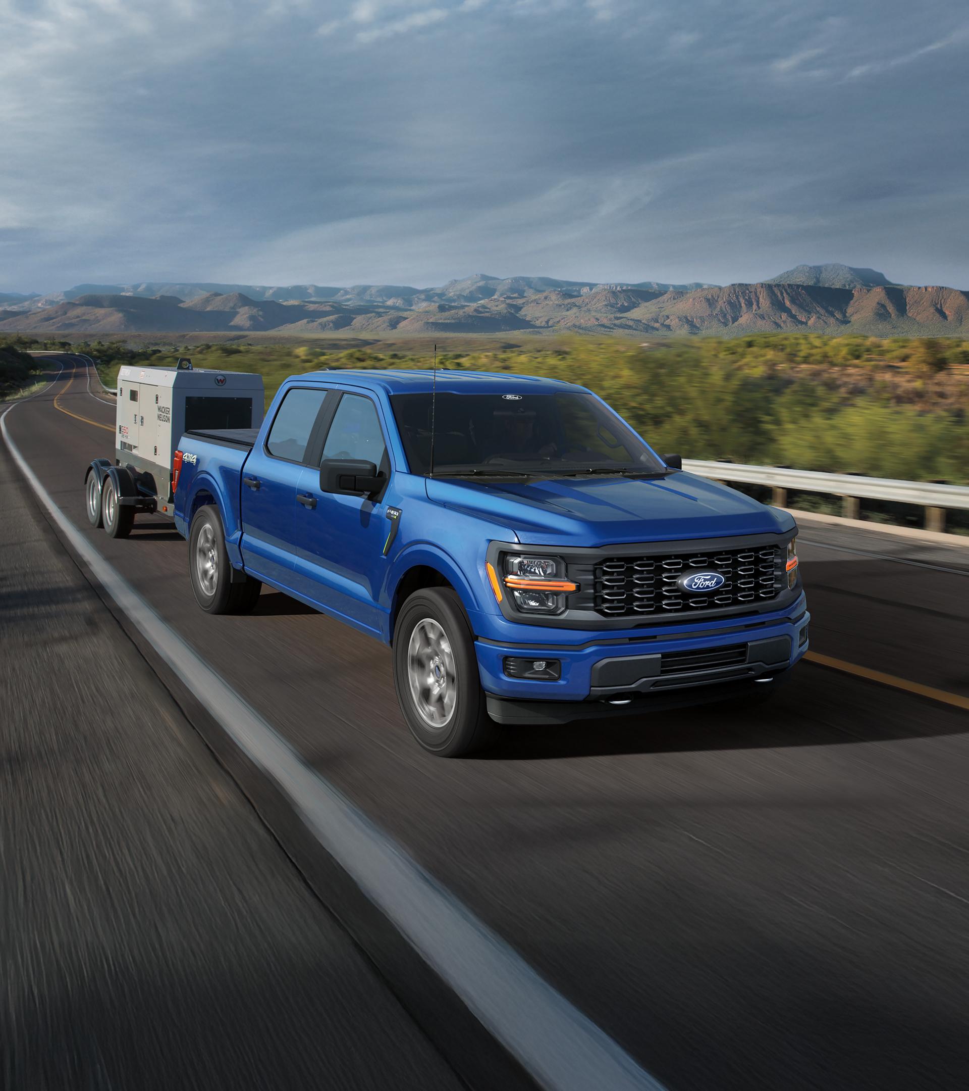 2025 Ford F-150® towing a trailer along a desert highway