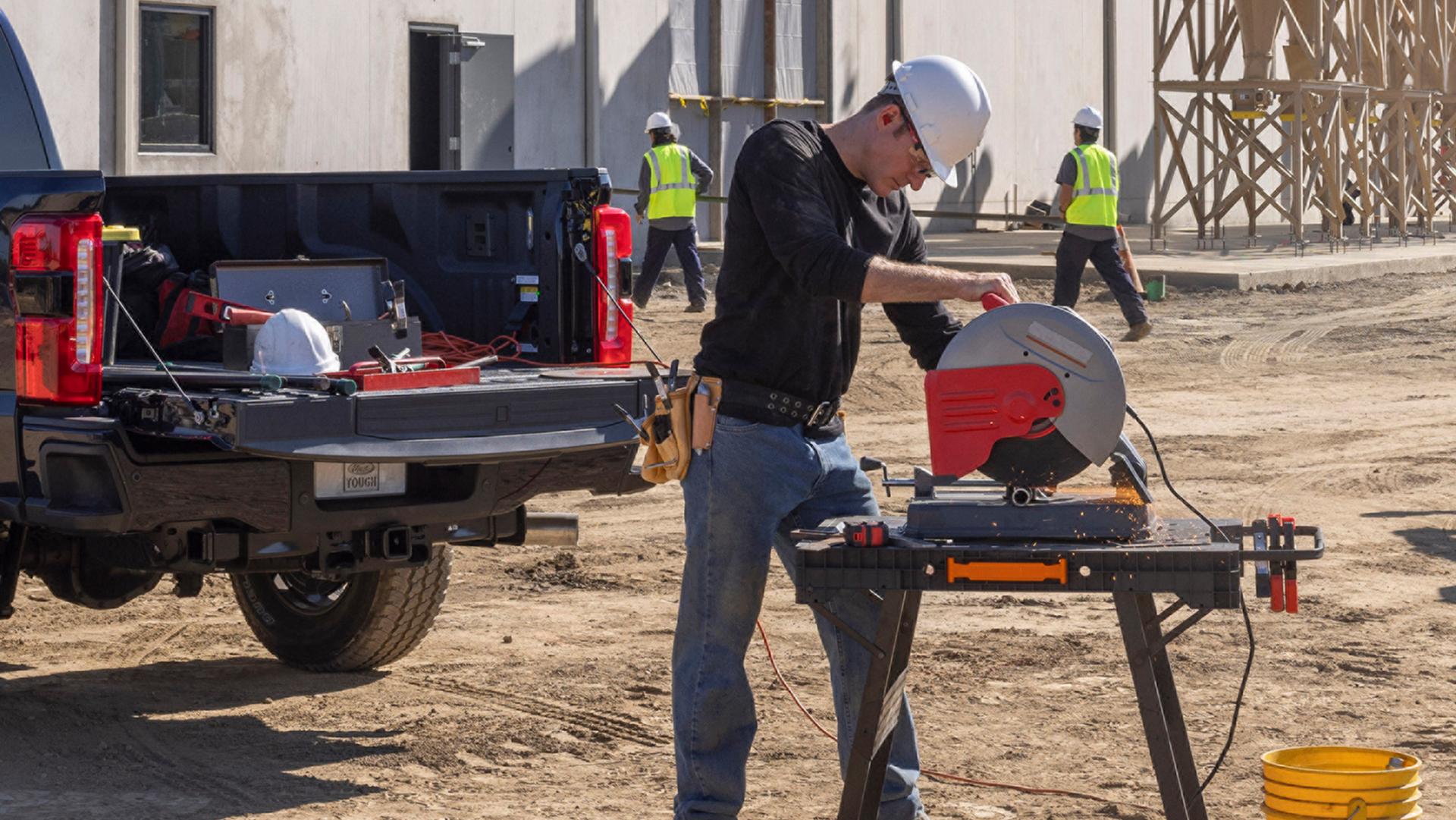 Person using the Pro Power Onboard™ – 2 kW feature on their 2027 Ford Super Duty® F-250® XL truck