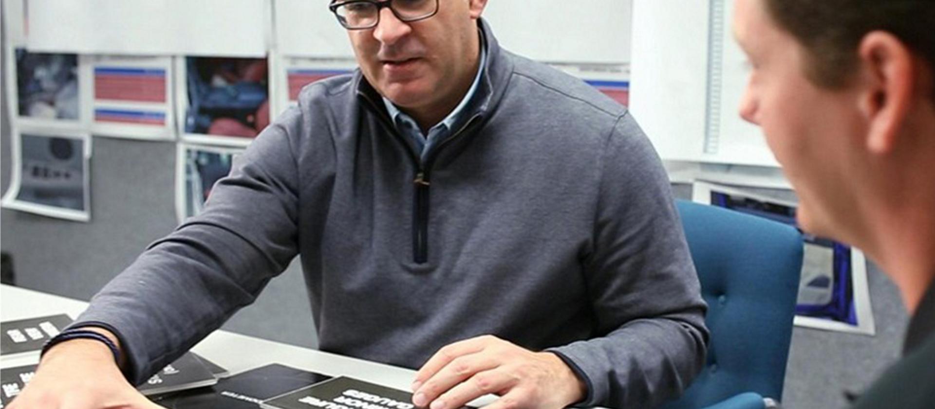 Two Ford employees interact in a design workshop