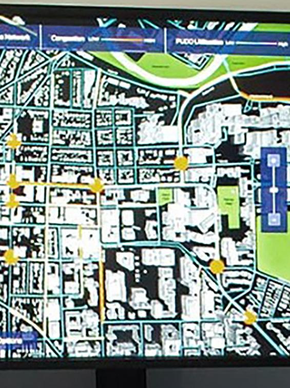 Two men observing the City Insights Studio