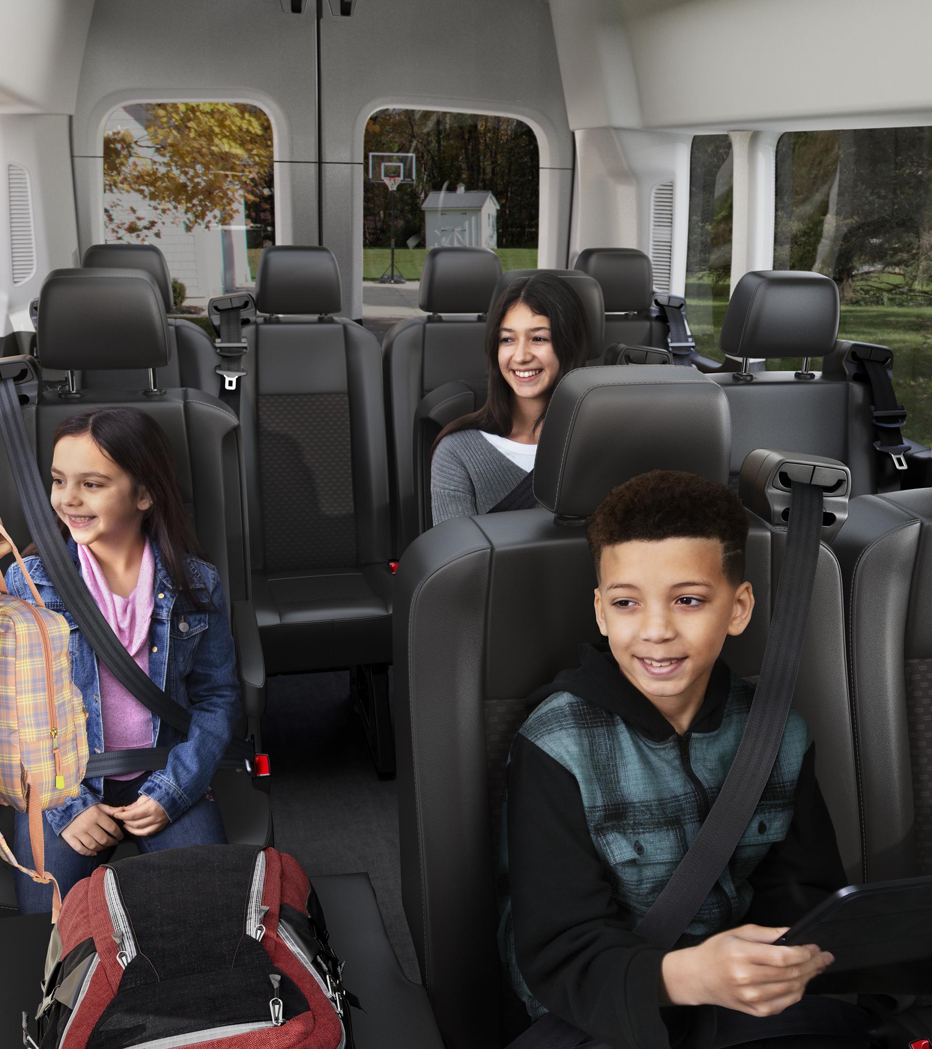 Interior view of adult adjusting seat belts for three children
