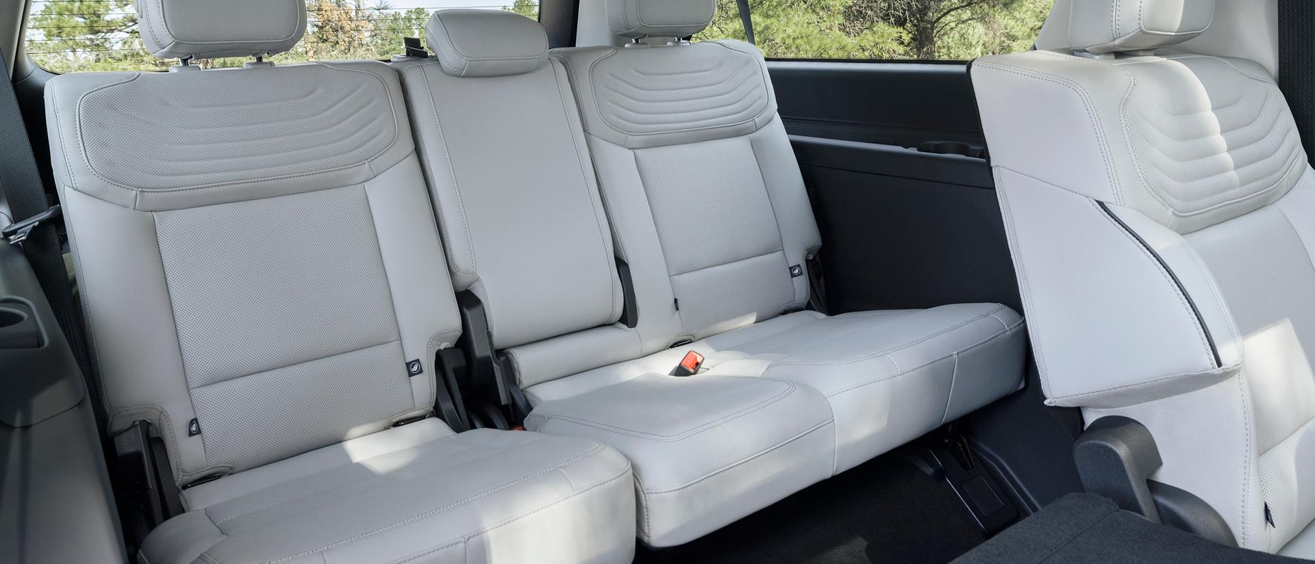2027 Ford Expedition® Platinum® SUV rear seating area with a seat folded flat