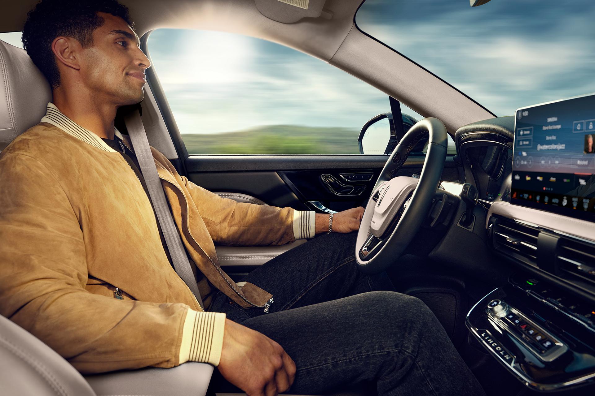 A man sitting in the driver seat of a 2025 Lincoln Corsair.