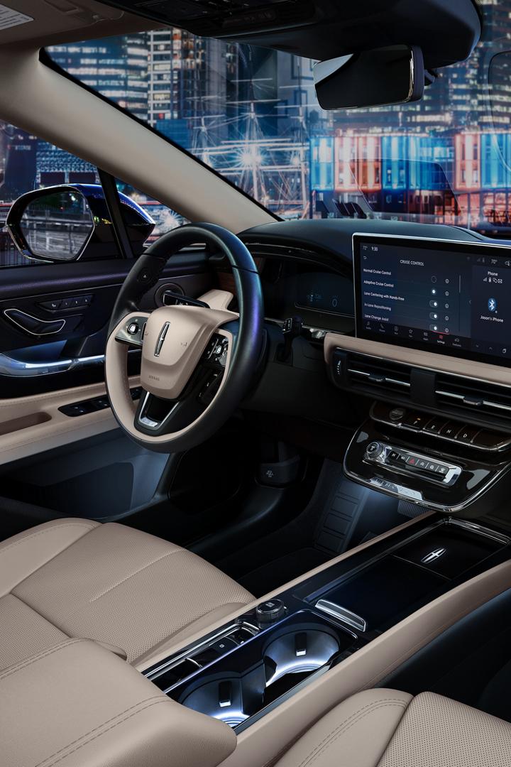 The interior of a 2025 Lincoln Corsair is shown in the Light Smoked Truffle interior colour