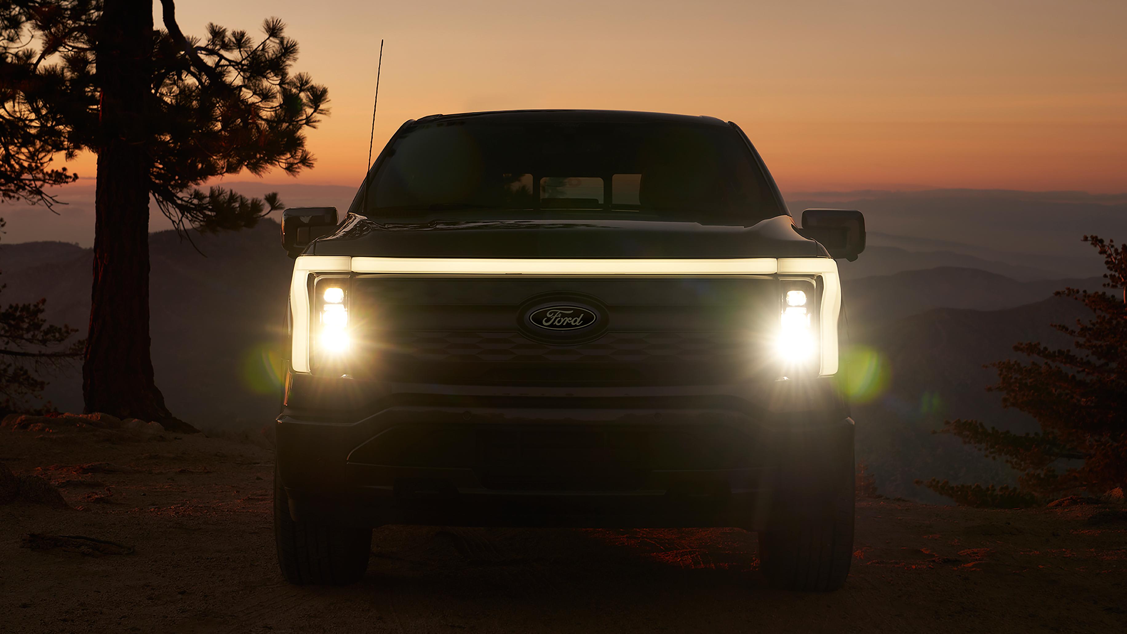 The front fascia of a 2025 Ford F-150® Lightning® pickup, showing the Front Signature Light Bar