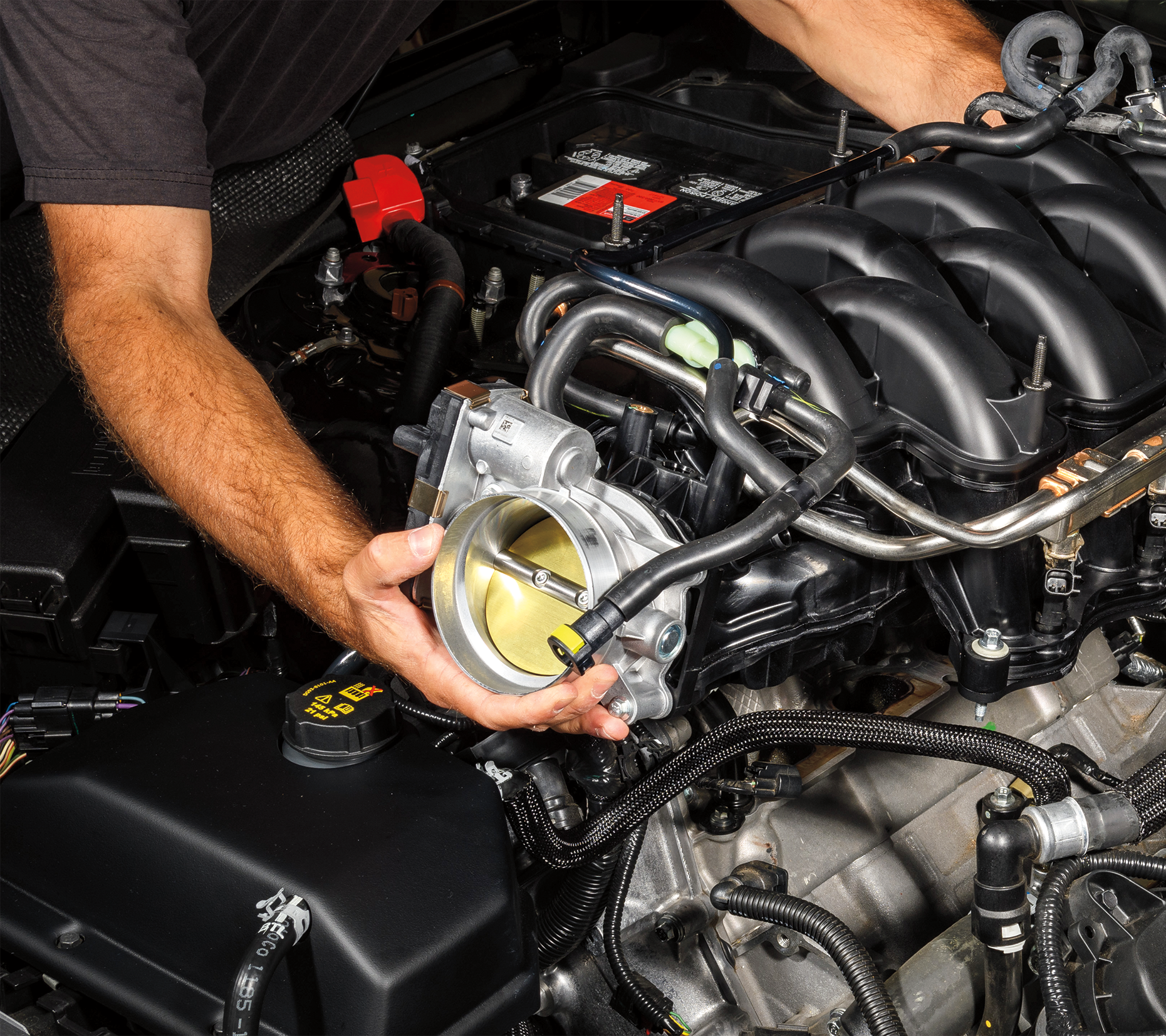 A Ford Service tech replaces an intake manifold